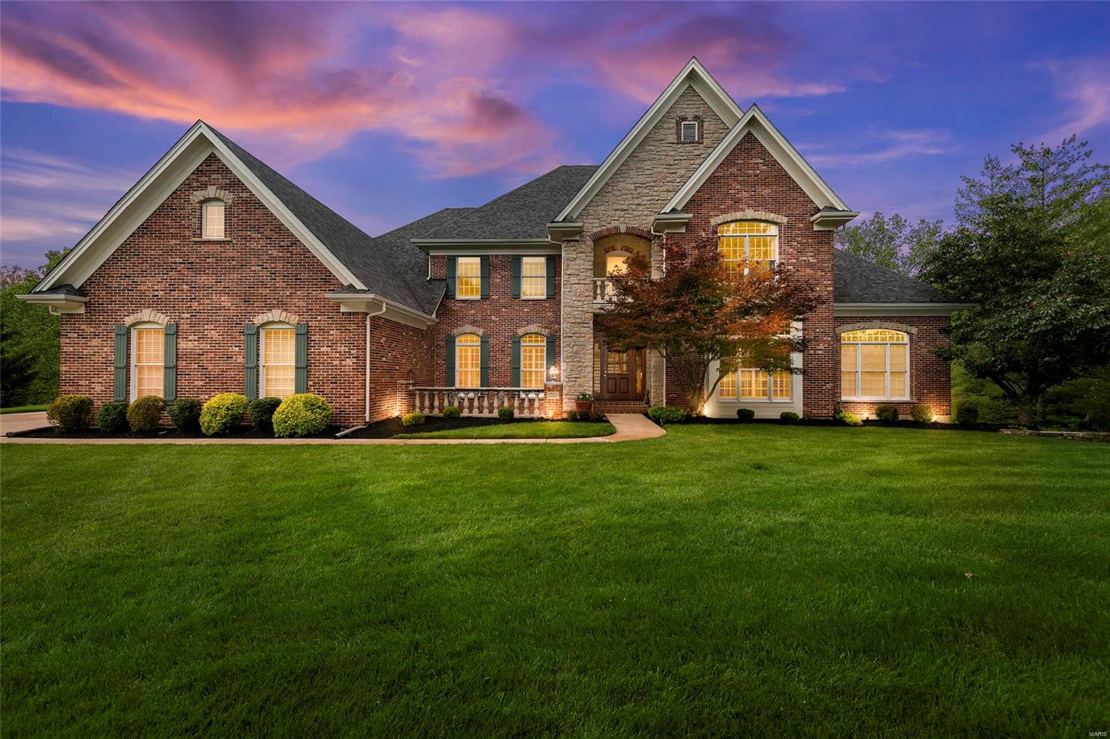 Stunning brick & stone French country style exec home w/ private, park-like yard w/ heated pool, hot tub and covered deck. Built by award-winning Premier homes this home boasts 6700  plus sq feet of living and 6 bedrooms, 5 full + 2 half baths. Walk-in to warm wood floors and take in the grand spaces w/ 10 ft ceilings and main floor office, main floor master suite, great room w/ fireplace, and vaulted hearth room. Serve guests from the classy main floor bar.  Explore your culinary dreams in the chef’s kitchen w huge granite island w/ plenty of seating.  Entertain this summer in your resort-like yard or poolside w/ inviting hot tub and fountain.  Relax in the luxury master bath w/ sep. shower and spa tub.  Upstairs find 9 ft ceilings + 4 generously-sized bedrooms - 2 w/ en-suite and 2 others share an updated j & j bath. Finished basement w/ extra bed, bath + rec room.  All in an upscale community w/ custom homes, close to shopping w/ Rockwood Schools + sought after Wildhorse Elementary