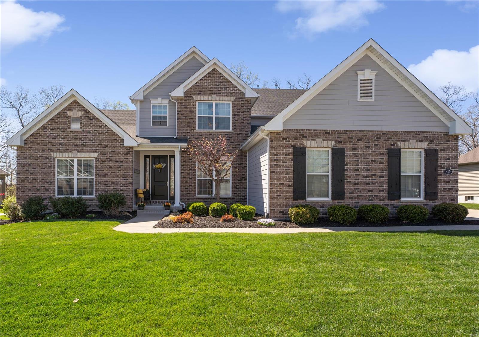 Spectacular Fischer & Frichtel-built 1.5 Sty featuring an open floor plan w/full-height windows, plantation shutters & handscraped hardwood flooring extending throughout the main floor. Impressive hardwood foyer leads to private study, formal dining room & stunning great room w/11’ ceiling & bank of windows overlooking wooded ground. Designer kitchen w/42” glazed cabinetry, granite countertops, stainless steel appliances & 8’ center island adjoins light-filled breakfast room & hearth room highlighted by floor-to-ceiling stone fireplace. Spacious primary bedroom suite w/luxury bath with freestanding tub offers an appealing retreat. Open staircase accesses 3 additional bedrooms, 1 w/ensuite bath & 2 w/Jack n’ Jill bath, plus step-up bonus room. Sliding glass door opens to outdoor living area w/patio w/an electric louvered roof w/remote & free form salt water pool. Neighborhood community w/over 50 acres of wooded common ground, pool, clubhouse, sport court, 3-acre lake & walking trails.