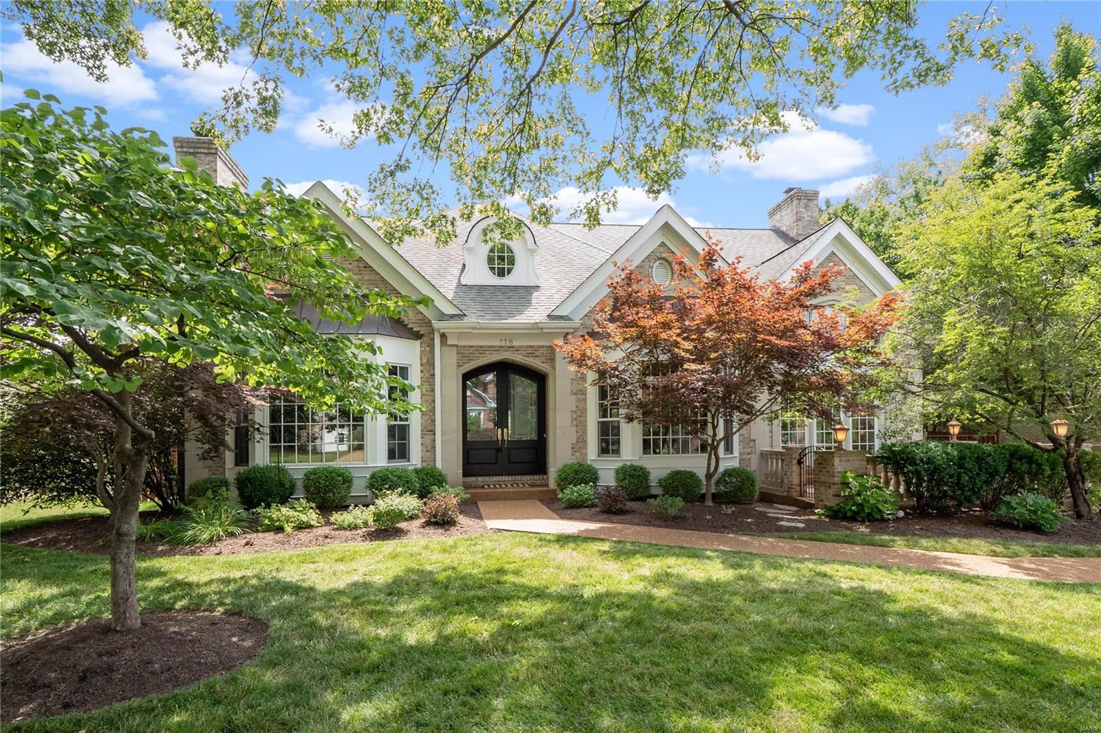 There is a certain mystique to the jewel know as Clayton Gardens. Is it the allure of those tree-lined streets of beautiful homes, the wonder of realizing that everything you’ve ever wanted is a just a stroll away? Or simply knowing that this is your life, you’ve arrived. The perfect marriage of form and function awaits through the grand foyer. A chic open floor plan beckons through the breathtaking living area to the stunning kitchen, featured in STL Homes for its sophisticated style & design. The Master Suite and Spa Bath with terrace is an oasis worthy of the Ritz! Upstairs offers three more large bedroom suites and laundry room. Fabulously finished lower level includes huge steam shower bath, exercise room, game room, and 2nd laundry. Professional landscaping and French doors and windows throughout the first floor lend a meditation garden ambiance to your dream. Establishing yourself in one of the most idyllic communities imaginable - brilliant.