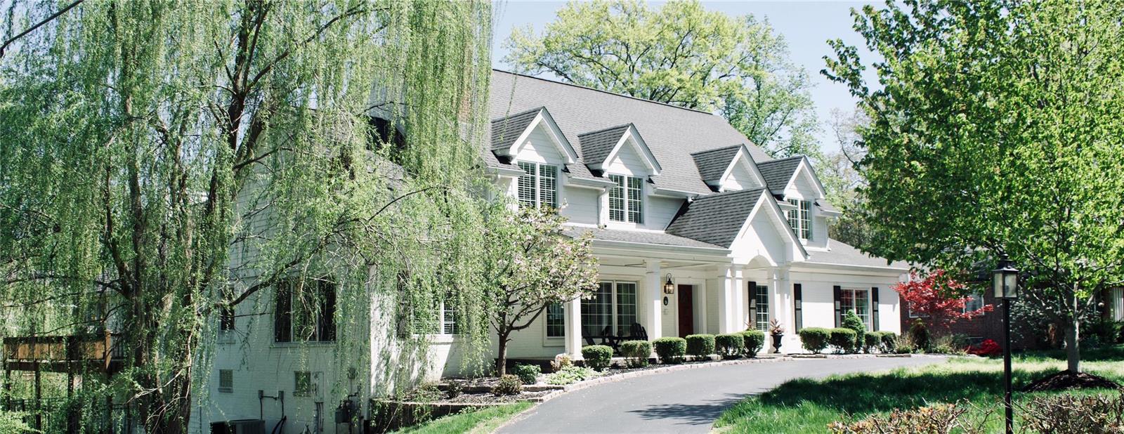 Amazing home designed by renowned STL architect, Lauren Strutman. Desirable York Village neighborhood with easy access to 40. Perfect family home, made for year-round entertaining, nothing over-looked. The vaulted kitchen/great room combo is stunning with wide plank hardwoods, custom white cabinets with honed black granite, all high-end appliances, 2 dishwashers, 2 ovens, pot-filler, separate ice maker, and gorgeous custom floor-to-ceiling fireplace. Huge main floor master suite has a beautiful bathroom with all Carrera marble tops, floor, and walk-in shower. Main floor laundry. Second floor has 3 bedrooms, 2 full baths, and a large family room for the kids. Finished basement has over 3,000 square feet including a bedroom suite, full bath and laundry room just for the pool guests, custom bar, and 2 cozy living rooms. Heated, saltwater pool, massive wrap-around cedar/composite deck, and whole house speaker system - inside and out, make this house a great place to relax.