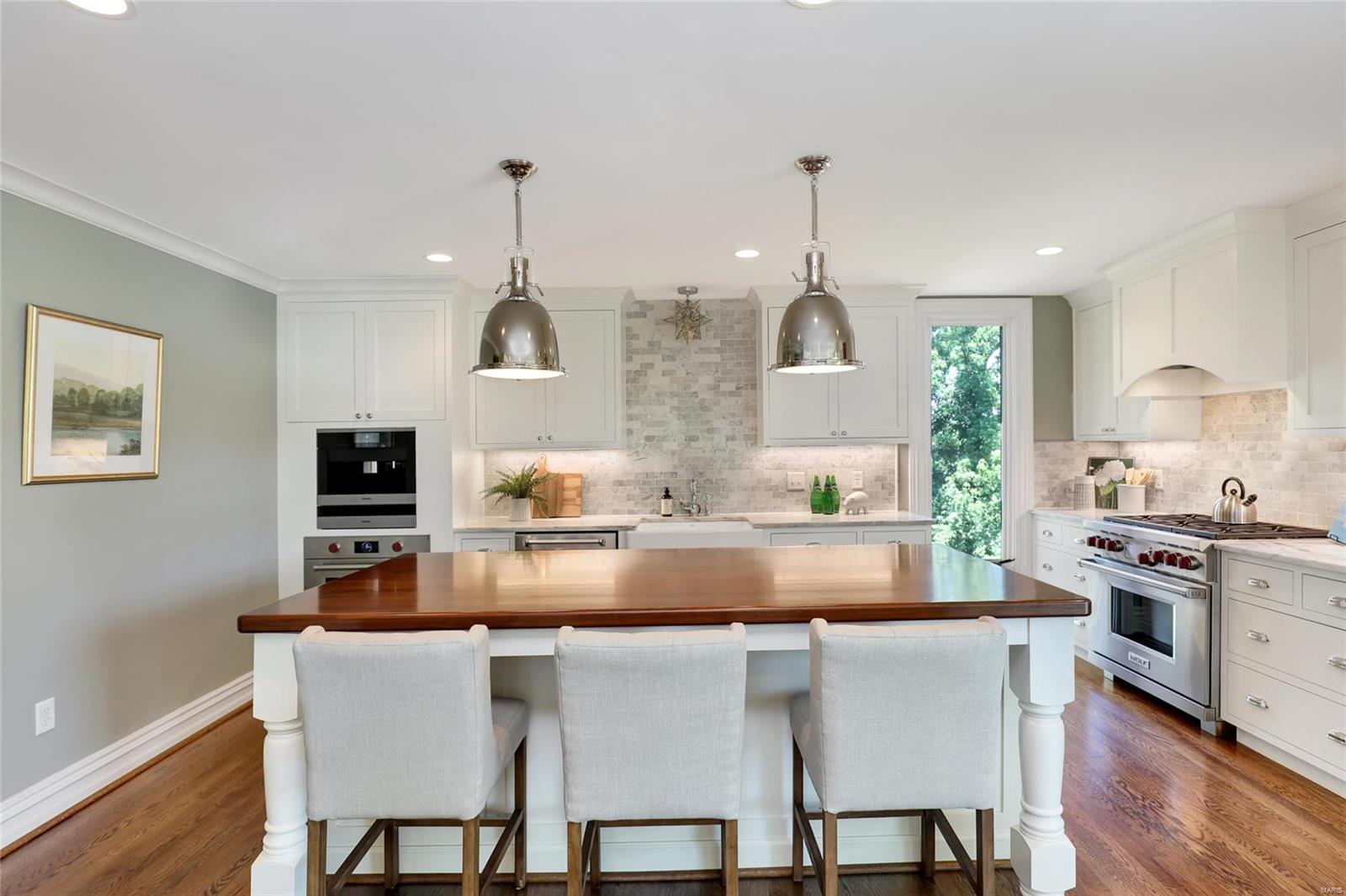 PENTHOUSE CONDO on a PRIVATE, GATED street in the CWE just 1 blk. off Euclid with a PRIVATE ELEVATOR THAT OPENS INTO YOUR HOME! Hardwood floors throughout, generously-sized LR/DR w/ motorized window treatments & new gas frplc., cook's dream kitchen w/ built-in Miele coffee/expresso center, huge island w/ mahogany top & seating for 4, Carrara marble counters, 6-burner Wolf gas range + add'l Wolf wall oven + SUBZERO fridge adjoins light-filled FR w/ 2 walls of floor to ceiling windows over looking the yard + 150 bottle SUBZERO wine cooler & built-ins. Private deck off FR is ideal for al fresco dining or relaxing. Spacious master suite w/ walk-in closet, spa-like, en suite bath w/ 2 ROBERN medicine cabs., free-standing soaking tub, walk-in marble shower w/ frameless door, dbl. bowl vanity & custom cabinets. 2 add'l bdrms, hall bath w/ CARRARA marble dbl. bowl vanity & floor. 3rd bdrm/library has built-ins & a charming non-functional frplc., 2 CAR GARAGE. Walk score 85! Location: City, Corner Location, Upper Level