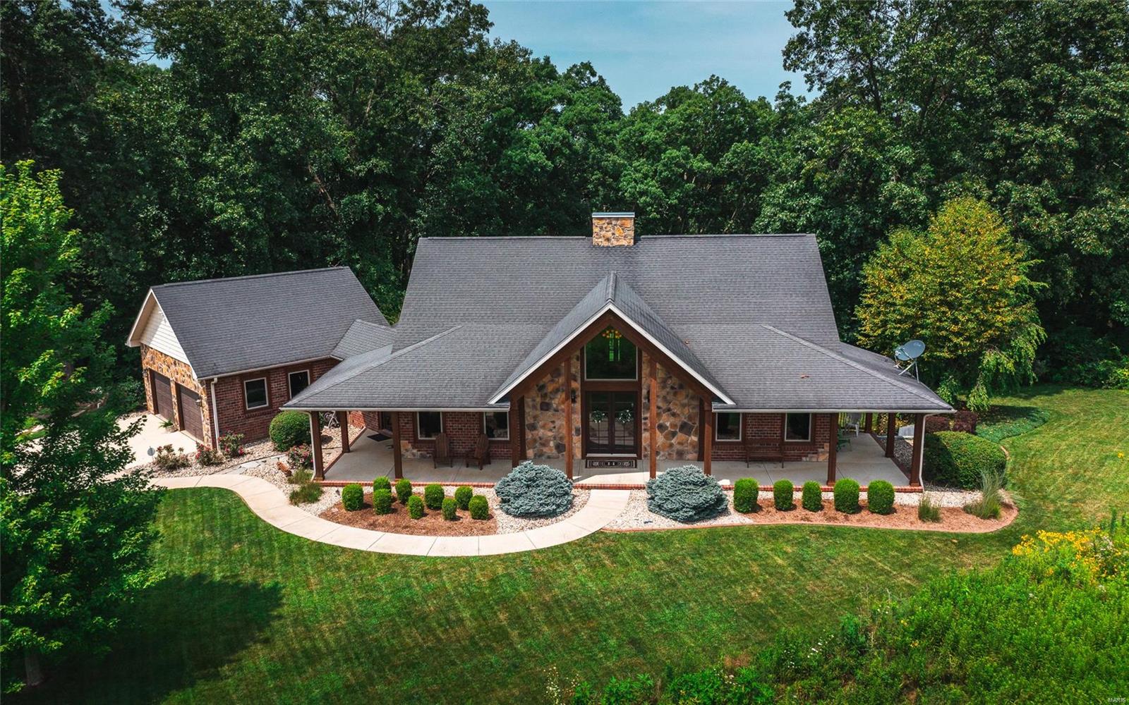 Welcome to Rocky Fork Creek Farm! This 142 acre offering is a paradise for any recreational living enthusiasts. The custom home was built in 2007 and consists of over 3,500 sq ft. The main floor provides an open feel with vaulted ceilings, expansive windows, large kitchen, fireplace, office, main floor laundry, and master suite. The lower level was designed for entertainment and includes a family room, full bath, bedrooms, and kitchen area. This home is equipped with an energy efficient geo thermal system, 400' deep well, and back up generator. 27.65 acres are beautiful native grass fields enrolled in CRP and the balance is in timber and improved wildlife habitat. Rocky Fork Creek borders the farm on one side and lays next to a wetland area that provides food and nesting grounds for waterfowl. The lake is over 20' deep and fully stocked. Plenty of storage is available for farm toys and equipment in the pole building. Seller willing to divide - ask for details.