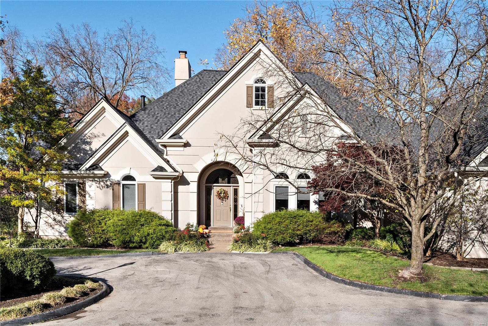 Beautiful 5 bed 3.5 bath atrium ranch nestled on a private 1 acre lot. Step inside the stunning entry w/ marble floors flowing flawlessly into a gorgeous formal dining rm. The well appointed living rm w/ gas fireplace is bathed in natural light w/ floor to ceiling windows & complimented by 14ft ceilings. A gourmet kitchen w/ Thermador refrigerator/gas stove, granite counters, & sunny breakfast rm are a chef's dream! Sip your morning coffee in the cozy hearth rm sporting beamed ceiling, custom bar & 2nd fireplace flanked by custom built-ins. Primary bedrm suite is a dream w/ walk in his & hers closets & a spa like bath featuring modern comfort height vanities, custom tiled walk in shower & soaking tub. 2 add'l bedrms w/ Jack & Jill bath round out the main level. Lower level offers a fantastic office, large bedrm, & rec rm complete w/ 2 custom bars, gas fireplace & wine cellar- the perfect spot to entertain! LOCATION! Minutes away from popular shopping/dining & highways 270/40/141. Wow! Additional Rooms: Wine Cellar