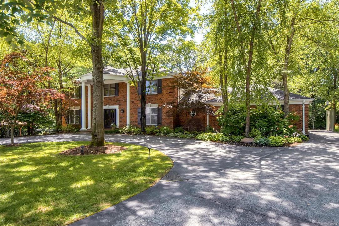 Open Sun, 8/7 1-3.This casually elegant family home, surrounded by lush landscaping & backing to private woods at the premier end of the cul de sac will delight you with its expansive rooms, floor to ceiling windows throughout & beautiful finishes including dark wood floors, special lighting, built-ins, high ceilings & incredible views. Very private 1st floor master suite w/fireplace & secluded wooded views off the balcony. Striking floor to ceiling new stone fireplace surround in the great room. New pool pavilion, stacked stone hot tub & deck invite lounging by the heated in-ground pool. The downstairs includes a large rec room, newly finished kitchen, media room, stunning windowed office/art room, gym, bath, changing room, & pool access.  New systems, siding, updated baths, Poynter designed landscaping in front & back, new exterior lights, generator & so much more.  It's like coming home to a private vacation retreat, but minutes away from everything & in sought after Ladue Schools. Additional Rooms: Mud Room