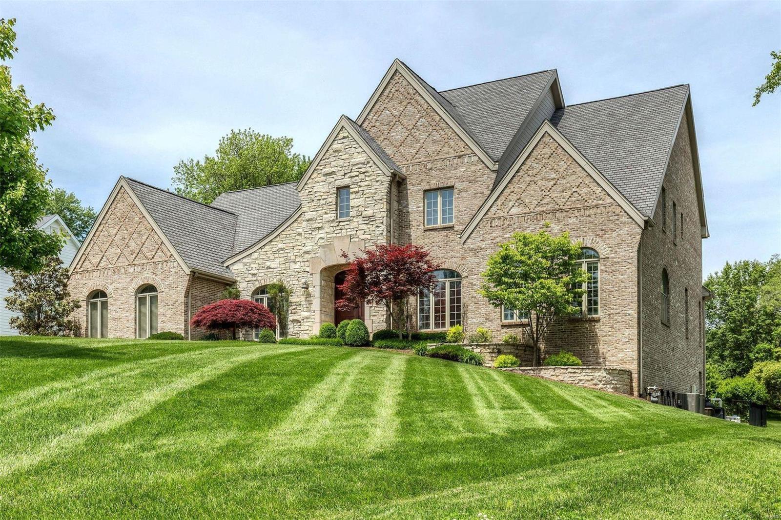 26 Spoede Lane has it all--Situated in a highly desirable neighborhood in Ladue Schools, backing up to Spoede Elementary, it is striking both inside and out. The 21 ft tall great room has floor to ceiling windows, main floor paneled office, master suite with steam shower/jetted tub, dining room with cove lighting, and custom millwork throughout. The gourmet kitchen has an oversized granite counter, custom cabinets, and opens to a hearth and breakfast room. 4 beds/3baths, a loft office and family room complete the upstairs. The lower level is amazing with a theater, fitness room, climbing wall, bar, poker room and it opens to the fabulous pool with stone wall and waterfall! Over 7900 sq ft of living space on just under an acre with 3 fireplaces, 3 car garage and so much more!!