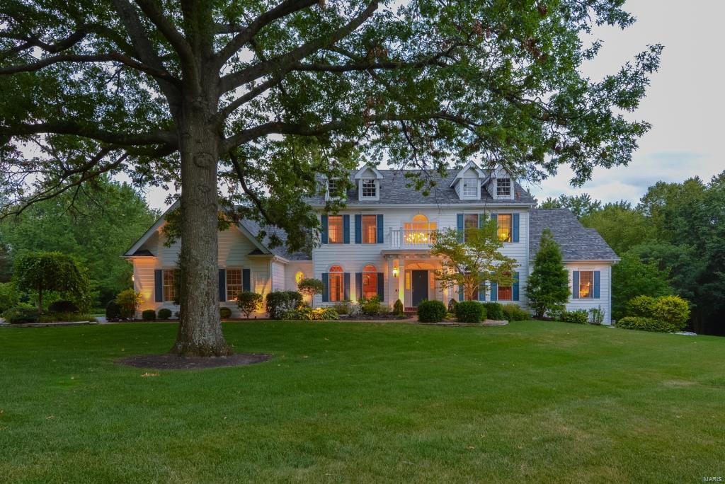 Stunning 1.5sty home on 1 acre! 5 Bd/4.5 Bth w/5600+ sqft living spc. 2sty Foyer w/curved staircase, Offc w/built-ins & Dining Rm w/crown molding. Great Rm w/frplc & wet bar; gourmet Kitchen w/maple cabinets, granite, island, brkfst bar, built-in desk & pantry; Brkfst Rm & Hearth Rm addition w/stone frplc & box bay window, stylish Powder Rm & convenient Laundry Rm.  Coffered Master Retreat w/walk-in closet & luxury Bth w/custom vanity, Whrlpl tub & separate shower.  Spindled stairs to 2nd Flr w/balcony, 4 Bds & 2 full Baths. Professionally finished, W/O LL w/large Rec Room, Media Room w/110” screen, custom Wine Cellar, full Bth & still plenty of storage.  Relax outside on patio & admire beautifully landscaped lot & trees; or cool off in the free form pool! Perfect home for entertaining family & friends! Great location – close to restaurants, shops, schools, parks & easy access to major hwys. Award-winning schools!