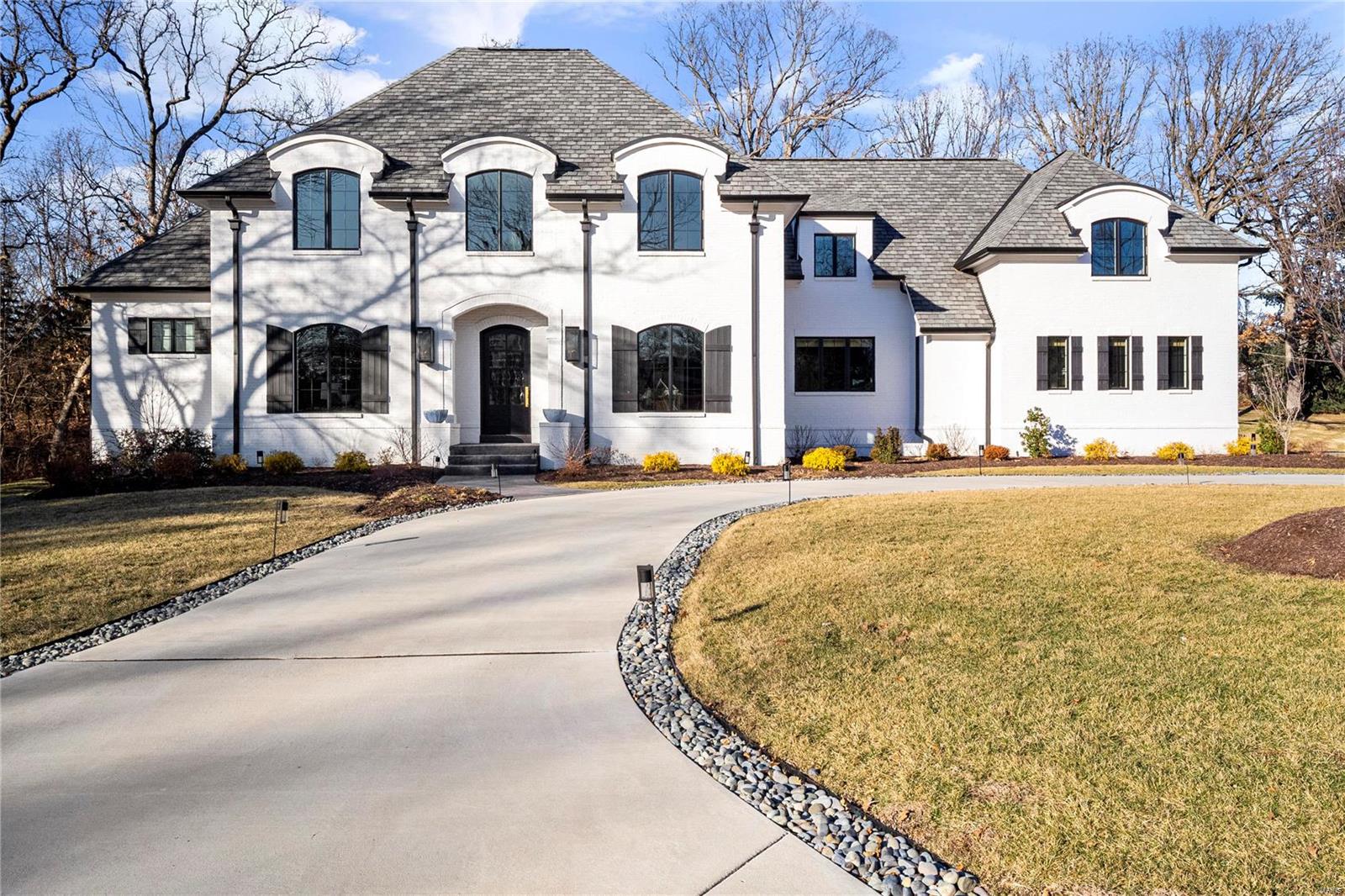 Truly exceptional in everyway. Completed 2 years ago, this beautiful custom home was designed with a stunning timeless style, down to every detail. Solid farm wood floors throughout 1st and 2nd floors. Arched Doorways. Beamed ceilings, Quality appointments to include the light fixtures, door knobs, tile work, counter tops, mill work....the list is endless. This is a very open floor plan, but maintains a sense of comfort and functionality. An amazing kitchen/hearth/great room is at the center. Formal office and dining to front. 1st floor master/sitting room with 3 additional bedrooms on 2nd  floor,  each with their own bath. Finished LL with family room, wet bar, billiard, full bath, exercise, media room, bedroom, gaming room. Above the 4 car garage with private access is a remarkable self contained apartment with bed, bath, study, family room, kitchen. Private yard with gorgeous in ground pool/ fountain, large covered patio with space heater, 2 ceiling fans, fireplace. Outdoor kitchen.
