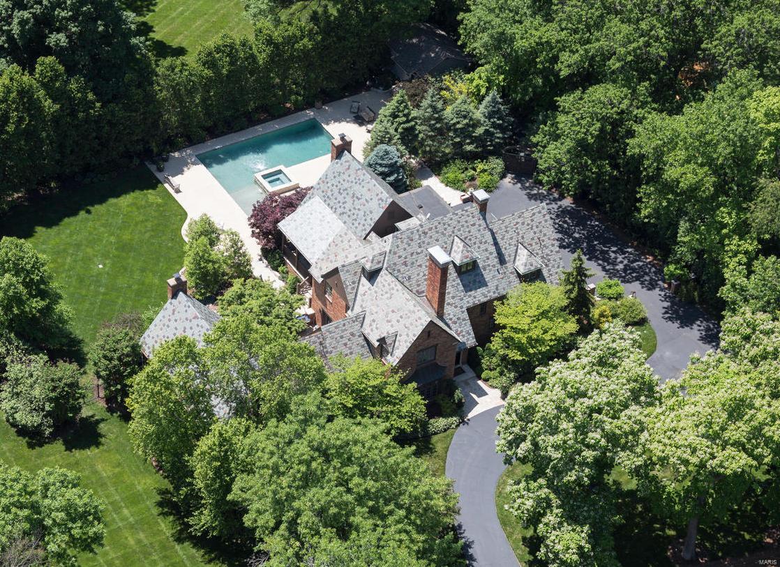 The very finest of homes in Historic Hampton Park. This 5,600 square foot English Tudor at 1167 Center Drive is fully recreated in every amenity, convenience, luxury and finish, both inside and out, overseen by Alan Brainerd, Design. The Main Level Master wing and vaulted Hearth Room additions are invaluable living spaces, now showcase signatures of this exceptional home. Private, fully enclosed grounds offer a newly configured Pebbletec saltwater pool and spa, with patios and custom landscaping detailed in boulders, tiered flagstone patios, stone retaining walls, and intricately designed lighting. All baths are fresh, with modern updates in the highest level of finishes. Additional living in the completed lower level provides state-of-the-art bar, media and gym.  Over $500,000 has been invested in design and improvements, since purchase in 2012. New garage and new laundry. Slate roof. 3 New HVAC systems. Tint windows and doors. Ideal Central location.