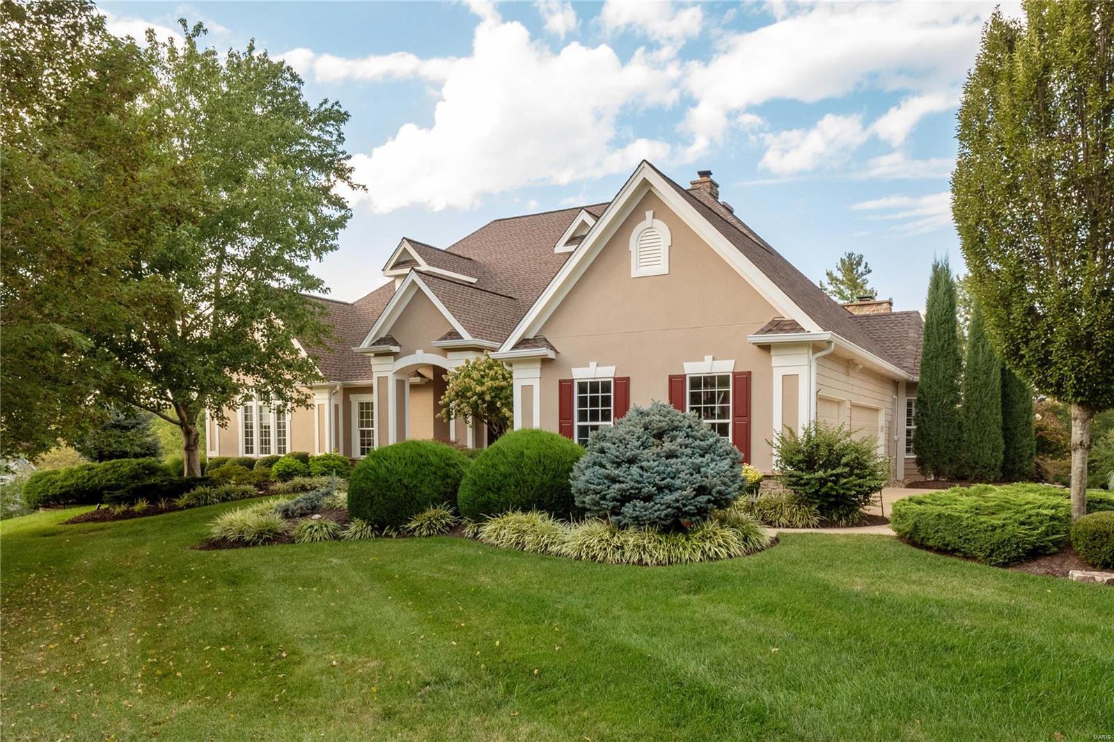 Impressive atrium ranch on a premier corner lot in quiet, tree-lined Country Lake Estates. Perfectly manicured lawn & professional landscaping surrounds the home. Inside the spacious rooms, 10 ft ceilings & abundance of natural light offer luxurious living. The heart of the home is the expansive gourmet kitchen, complete with a breakfast room, ample counter & cabinet space, stainless appliances & vaulted ceiling hearth room. Adjacent to the kitchen is the main floor laundry & mudroom, conveniently located off the 3-car garage. Retreat to the spacious main floor primary bedroom feat. a large walk-in closet & spa-like bath with heated floors. Sunlit main floor office overlooks the beautiful grounds. Two additional main floor bedrooms share a jack-&-jill bath. The walk-out lower level offers even more living space, including a bedroom, full bath, large rec room, media room & 2 bonus rooms. Cozy up next to the fire in your outdoor room with a 2 sided fireplace, perfect for year-round use!