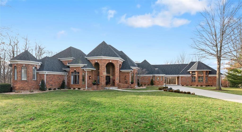 One of the sexiest homes in St. Charles County! Full Brick Custom situated on the Exclusive Estates Ct* Palatial-Unparalleled-Impressive Scale* Astounding Finishes*8.300+ sq ft living* Grand 2 Stry Marble Fyr* Handsome Office w/Mahogany Blt-ins, large Bay, Coffered Ceil* Great Rm has soaring ceilings/wall of windows allowing an abundance of light, overlooking 3.79acres. Wainscoting accentuates gallery sized walls*Deck expands full length of Home* 2 see-thru fp* Gourmet Kit, Quartz tops, expansive island, custom cab, finest appliances* Frml Din Rm* Lux Owner’s suite. Walls of custom bltin dressers, spa-like ba, heated flrs, soaking tub, stunning marble shower, dual closets, beautiful built-in vanities* Lwr Lvl allows for 2nd Fam Rm, Hearth Rm, FP, Gorgeous Bar, Fitness Studio, Billiard Rm, Den, full bath* Dual walkouts for seamless in/outdoor living* Bltin surround, sec cams, 4-zone Hvac* Htd/Cool Carriage House w/full ba* Lasting elegance w/contemporary expectations! Pure Tranquility! Additional Rooms: Mud Room