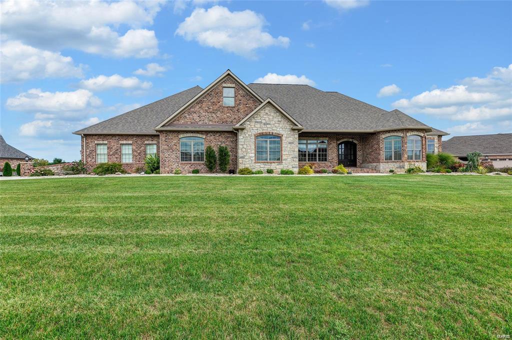 Nestled in the upscale Brellinger of Northern Columbia, this stunningly appointed estate home showcases top-shelf finishes throughout.  The exterior living spaces inspire entertaining & enjoyment with their picture perfect features.  Extensive landscaping surrounds the Pebble Tec Auto-Fill pool, complete w/waterfall & fountains.  An adjoining covered patio showcases an outdoor kitchen & fireplace.  Entering the impressive foyer, be greeted by soaring 14 foot ceilings, arched doorways, crown molding, & abundant natural light.  Gourmet kitchen showcases gleaming stainless steel appliances, extensive tile work, 6 burner gas cook-top w/hood, plus an attached hearth-room leading to the patio area.  The master suite boasts tray ceiling w/crown molding, dual closets, & luxury en suite w/soaking air tub, ,adult height dual vanity & walk-in tile shower.  Find Travertine flooring in the baths, well-planned spaces, Geothermal system, 2 water heaters, & 9 ft pour in the unfinished lower level. Additional Rooms: Mud Room