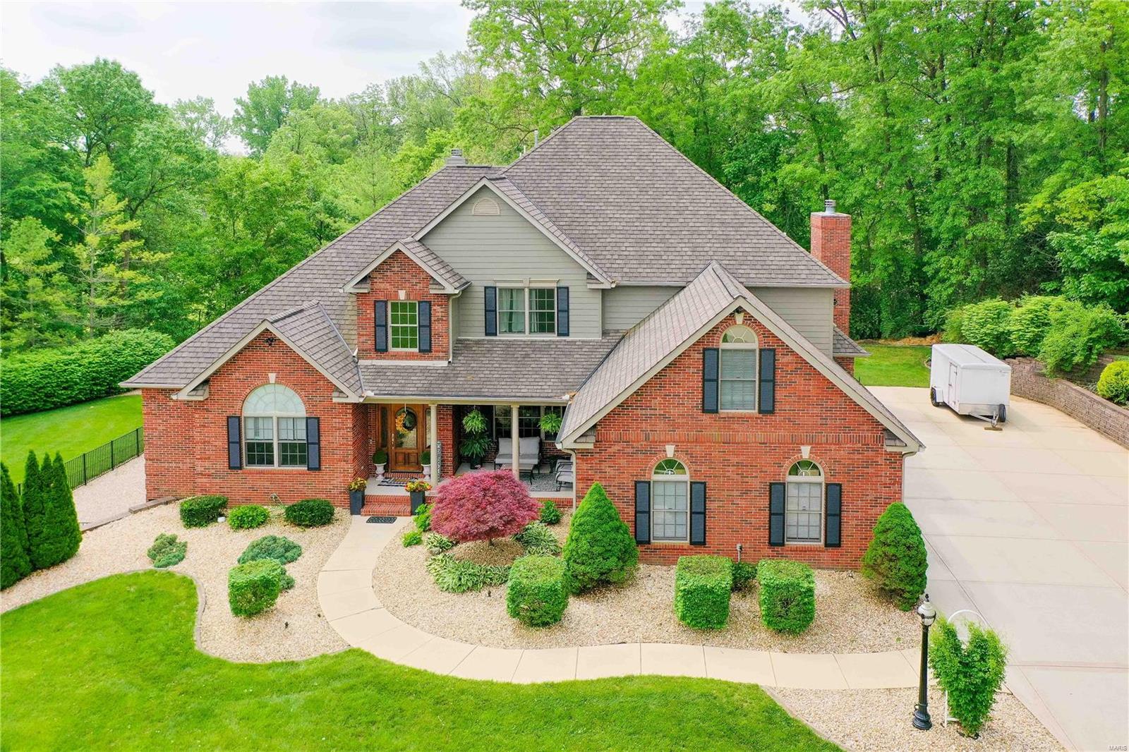 Highly sought after Edwardsville School District with the benefit of the Fort Russell Tax rate! This custom-built property offers a vacation-at-home experience, situated on over an acre cul de sac lot on the 5th & 9th holes at Fox Creek Golf Course. Boasting an expansive 7000+ sf of living space, this home features 6 beds & 6 baths w/ primary suite on main level. The gourmet kitchen w/ high-end appliances, custom cabinetry & ample counter space is a chef’s delight! Large open floor plan makes this the perfect space for entertaining. Upstairs bedrooms come w/ their own en suite, ensuring privacy & convenience for family & guests. The saltwater pool, hot tub, large composite deck, stamped concrete patio and screened porch are perfect for hosting gatherings. The walkout basement of this remarkable home includes a full kitchen w/ pantry, large bdrm w/ walk in closet, bath, family, 2nd laundry & exercise rooms. Schedule a showing & experience the epitome of luxury living!