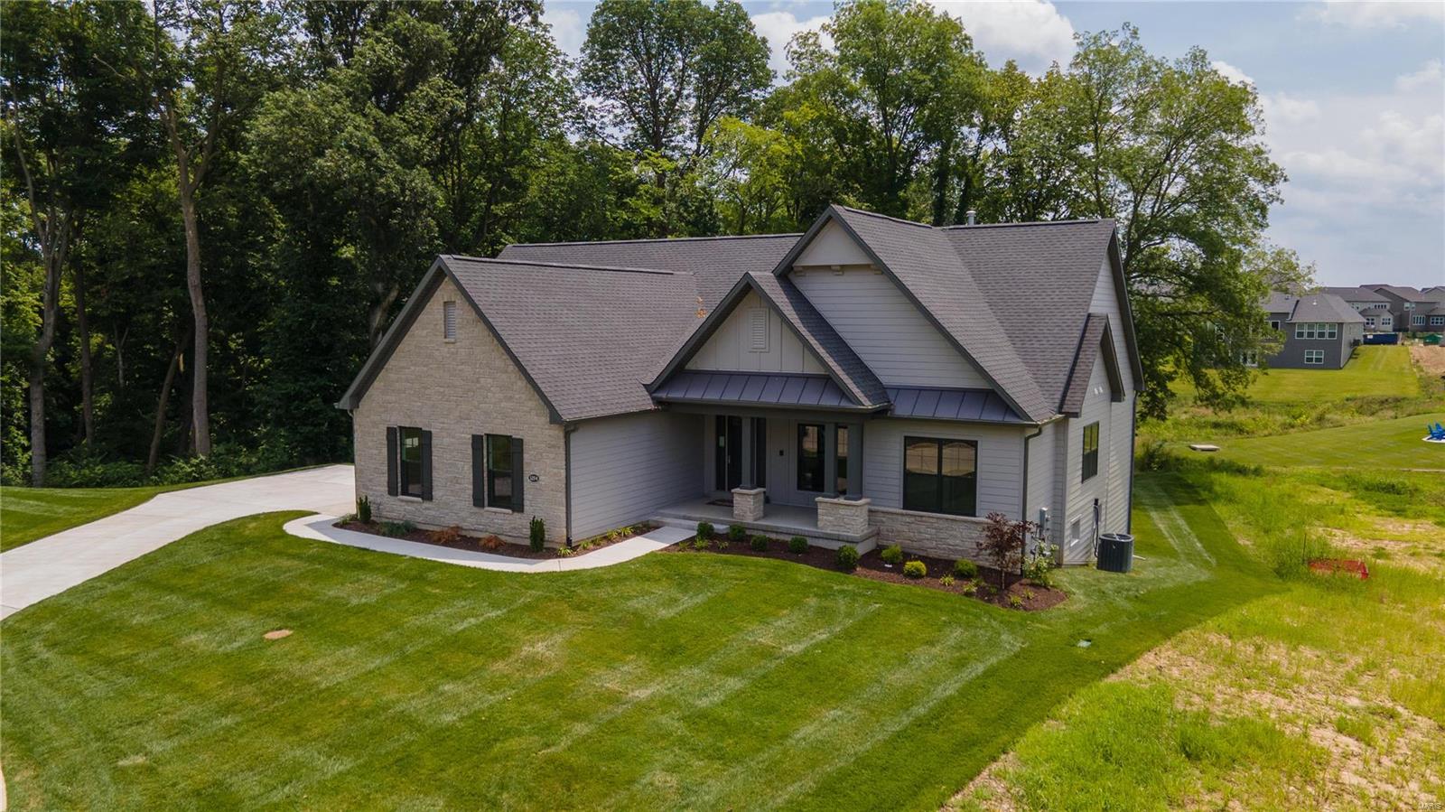 MOVE IN READY! Executive, free standing villa by Fischer and Frichtel in Fienup Farms, an amenity-rich community in Chesterfield. This stunning home sits on a W/O, cul de sac lot backing to trees and common ground in an exclusive community of 17 villas. This 2 BD, 2.5 BA, 2,765 s/f ranch has a side entry 3 car garage w/auto court, 9’ pour, 17x14 screened composite deck & patio. Features inc 9’ clngs w/12’ in the Grt Rm, study w/glass doors, wr iron spindles, gas FP, hardwood flrs, cer tile in the baths & family foyer, Deluxe Kit, 42” cab, soft close cabinets, upgraded SS appl, dbl oven, drawer micro, chimney hood, large island w/brkfst bar, Quartz c-tops, W/I pantry, frml DR, tray clng in Mstr Bdr, Lux Spa bath in the Mstr, 8’ solid doors, James Hardie siding & elegant stone façade. Enjoy ext ground maint provided w/a monthly HOA fee. Located near shopping & restaurants. Enjoy a premium lot, fantastic finishes, exquisite architecture, lawn maint & snow removal provided (per C & Rs). Location: Detached