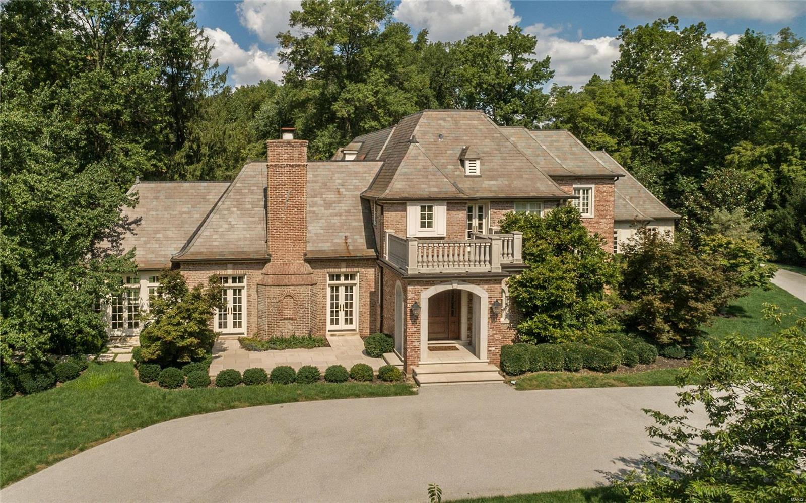 Respecting the original French Manor charm, this expanded and renovated essentially 10 year new home sits on 3.56 landscaped acres. With exceptional finishes throughout, the 5+bedroom, 6.5+bath home offers elegant yet casual living spaces. The foyer opens to the 18'beamed ceiling LR with limestone fireplace, garden room and formal dining room. An exceptional kitchen demands dual islands, custom cabinetry and professional quality appliances that adjoins the breakfast room and hearth room with FP and French doors to private terrace. An office, bar area, laundry and mudroom complete the main floor. Upstairs is the master suite with study, stunning marble bath and huge walk in custom closet. There are 4 other bedroom suites, study area & 2nd laundry room. The finished lower level offers a home theater, billiard room, FR with fireplace, wet bar, exercise room, full bath, space for wine room and storage. Heated pool, 4 car heated garage,geothermal HVAC, flagstone patios, irrigation system Additional Rooms: Sun Room
