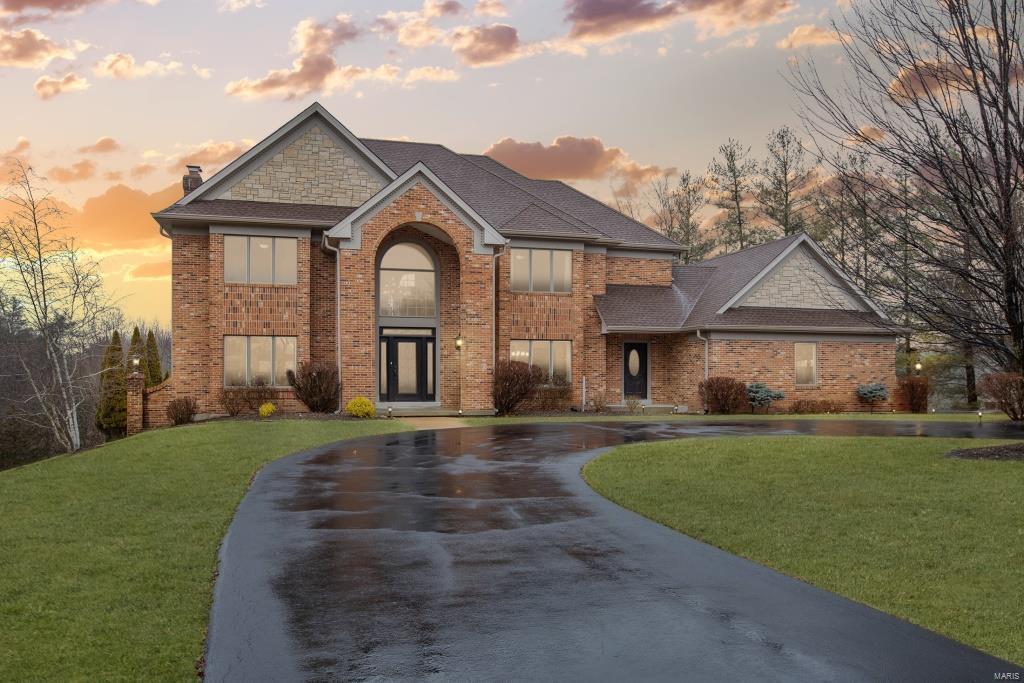 Recently featured in Saint Louis Homes and Lifestyles magazine, this fully updated 2-Sty in Clarkson Valley is sure to impress! Inviting Entry opens to formal Living & Dining Rms. Family Rm w/stunning stone FP & 3-Sty wall of windows that overlook the rear yard & pool. Gourmet Kitchen boasts a waterfall island w/prep sink, custom white shaker-style cabinets, Sub-Zero fridge, Wolf 6-burner gas range, built-in banquette dining, custom walk-in pantry & beautiful Hearth Rm w/access to deck. Main Flr Laundry & Powder Rm! T-staircase leads upstairs, featuring vaulted Master Ste w/gas FP, dual walk-ins & updated Bth w/gorgeous tilework, corner jetted tub, dual vanities & walk-in shower w/multiple heads; as well as 3 Bds, 1 w/private Bth, other 2 share Jack/Jill Bth. W/O LL w/Rec Rm, gas FP, wine fridge, 2 Bds & full Bth! Multiple outdoor living areas - enjoy the spectacular views & heated pool! Rockwood Schools & minutes to Chesterfield Valley!