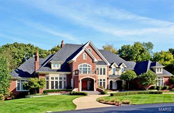 Dreams really do come true!!  Once in a lifetime opportunity to purchase this custom 1-1/2 story exquisite 10,800+sf home situated on a private wooded lot backing to Hunter Farms.  Designed by Dick Bush and built by DeShetler, this showplace is loaded with high end detail ceiling treatments, custom millwork and luxurious features found in very few homes.  The first floor boasts minimum 10' ceilings, open floor plan, grand 2 story entry with oversized staircase, great room with built in bookcases & volume ceiling,  gourmet kitchen, hearth room with gorgeous window wall & oversized sit down bar, richly paneled library, master bedroom retreat with his and her baths, fireplace, and sitting room.  The finished lower level includes huge recreation room complete with bar and kitchen, game room, state of the art media room, wine cellar with humidor, exercise room, his and her pool baths.  Rear yard has pool and spa, outdoor kitchen, 2 decks, 2 patios, screened porch set in trees.