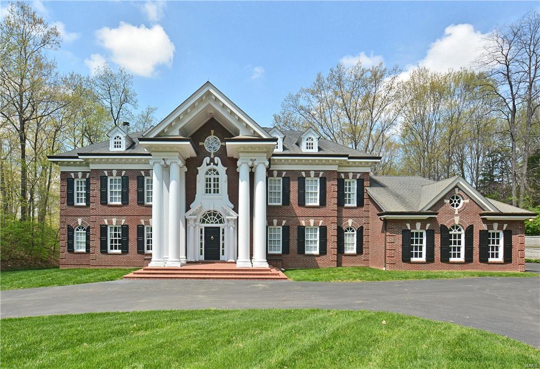 Private gated estate on 10+ beautiful acres.  All brick 1.5 story offers nearly 6500 sq ft of custom finishes. Impressive 2 story marble entry foyer with hand crafted staircase flanked by den with fireplace & formal Dining Room with arched openings & extensive moldings.  2 story Great Room with 2nd fireplace, french doors leading to the deck & wall of windows.  Kitchen breakfast room area offers a 6 burner gas cooktop, double ovens, breakfast room bay & flows to the vaulted Hearth Room with 3 walls of windows overlooking the water falls.  Main floor master suite & luxury master bath with marble floors, Palladian windows & large walk in closet. Upper level balcony overlooks the Greatroom & 4 spacious additional bedrooms. Custom deck built with exotic IPE wood spans the rear of the home overlooking 10 breathtaking acres, Koi pond & 4 beautiful waterfalls.  4 zoned thermal HVAC system. Sprink. sys., Alarm. New roof and custom copper gutters installed prior to closing. Additional Rooms: Sun Room