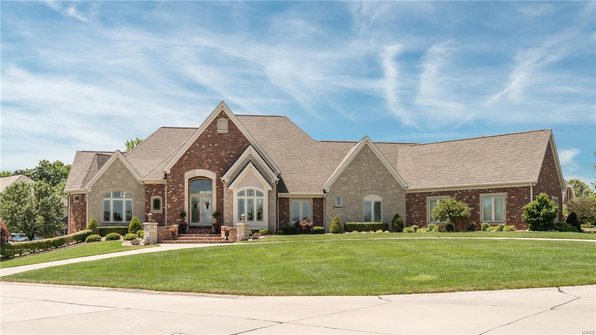 Prestigious Windcastle home will amaze w/full stone & brick exterior. Custom details, exquisite finishes & architectural detail abound from the multi-coffered, box beam & unique ceiling details throughout the home, lighting features, whole house surround sound, exceptional millwork, 4 FPs, central vac & travertine floors. Expansive kitchen w/staggered, lighted glass cabinets w/pull outs & molding, premium appliances, sprawling granite counters & butler’s pantry open to a spacious hearth room. Master suite is a lavish retreat w/built-ins, huge jetted tub, his & her vanities & prof organized closets. Private, elegant study w/FP flanked by custom wood built-ins & cathedral ceiling will impress! Walk-out LL designed for entertaining, w/wine cellar, bar w/cherry cabinets, FP, spacious rec & billiard areas, theater area, bedroom w/full bathroom & flex room! Oversized 4 car garage & custom, main floor laundry. Poolside BBQ’s are a dream in the private, lush garden setting. Incredible value!