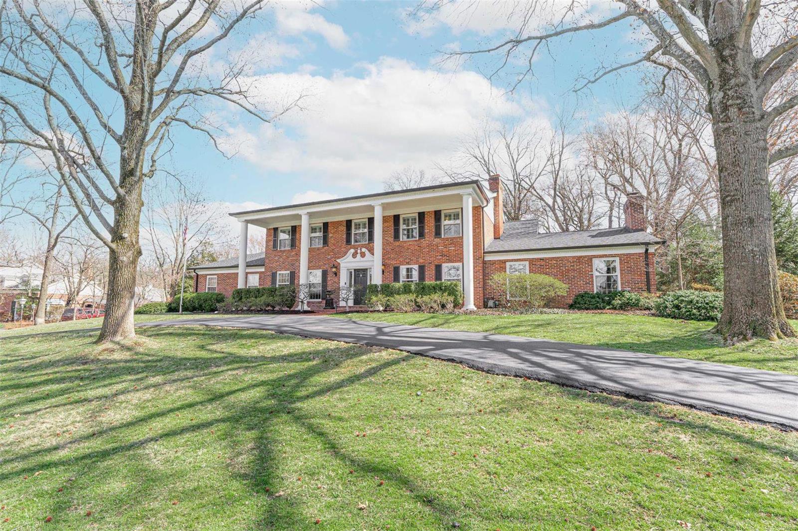 Classic and timeless, this picture-perfect residence embodies Ladue at its finest. The home's heart is the new (2019) kitchen and family room, featuring custom inset cabinetry, Wolf/SubZero appliances, wine tower, beverage drawers, icemaker, and extra dishwasher. Not to be outdone, the oversized mudroom caters to today's busy lifestyle with heated floors, built-in cubbies, two wall ovens, laundry sink, pull-out drying racks, and pool bath. Beautiful vaulted hearth room with wet bar and wood-burning fireplace, plus adjacent office with an exterior entrance. Ascending the curved staircase, you will find the Primary Suite with dressing room, walk-in closet, dual sinks, makeup area, and soaking tub. Bedrooms #2 and #3 both have ensuite baths, while Bedroom #4 uses the hall bath. Finished basement with wet bar, full bath, and cedar closet. Three car attached garage. Fenced yard with brick terrace, pool, playset area, and professional landscaping. Additional Rooms: Mud Room