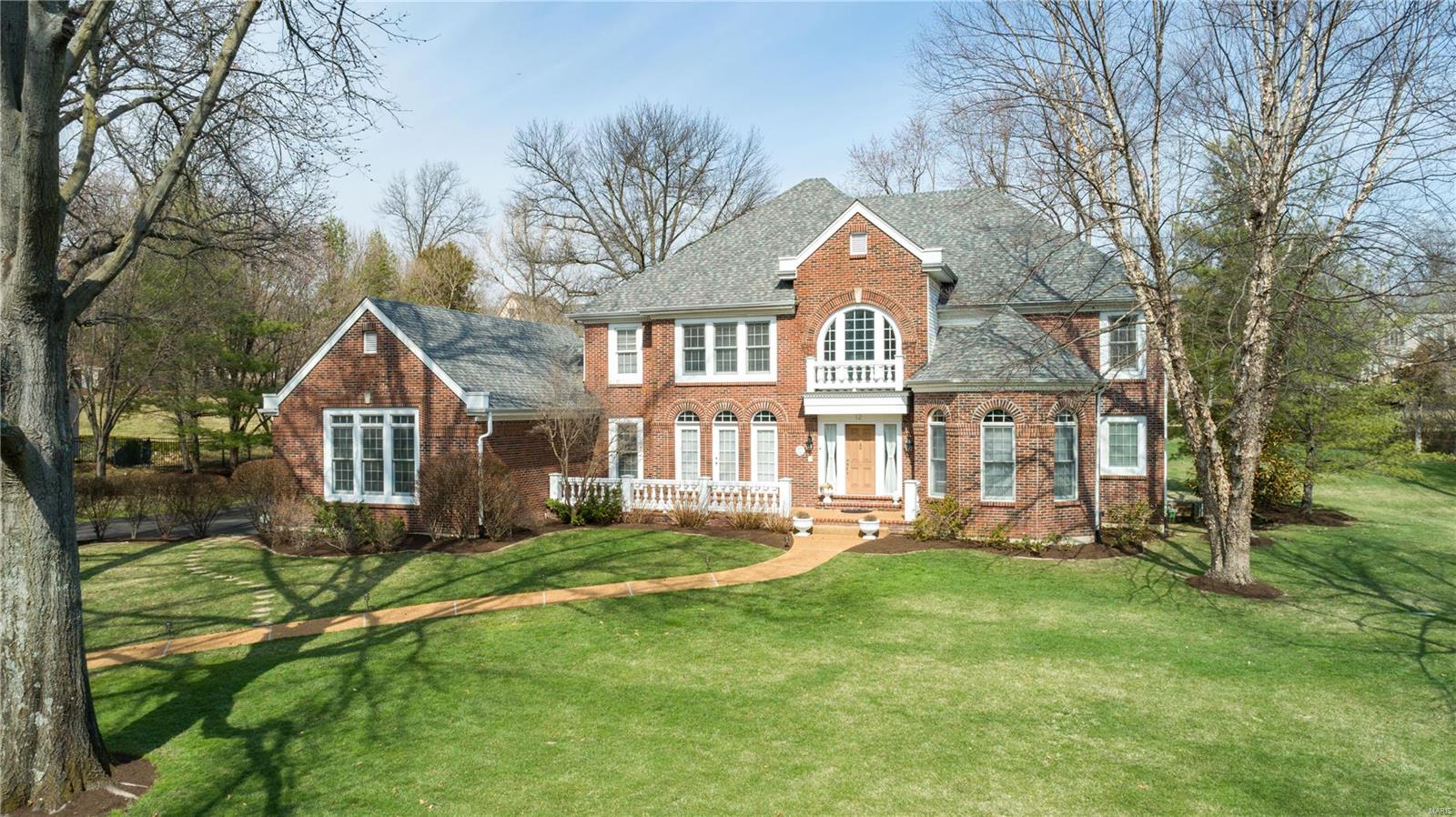 On a quiet street on an acre+ in Creve Coeur, 12 Ladue Meadows has extensive landscaping, an in-ground irrigation system, & a huge yard. There's an exceptional amt of living space featuring a main flr Master & first flr laundry. Enter the grand 2 story entry w marble floors flanked by a coffered DR & study/den w 11' ceilings. The vaulted great rm has special moulding & millwork w a wall of windows. Down the hall find a wetbar great for entertaining & a kitchen w SS appl & granite counters. Enjoy a brkfst rm & vaulted hearth rm that leads to the patio. The master suite features coffered ceilings & ceramic floors, his/hers sinks, separate tub & shower & walkin closet. Upstairs find 4 addtl beds ea w walkin closets, 2 full & 1 Jack & Jill bath. The LL has a mini-kitchen, full bath, rec rm & tons of space, plus addtl storage & access to 3 car garage. The location near 270, 40, Ladue & Lindbergh make this an ideal home if you want a neighborhood w easy access to nearby schools & hospitals.