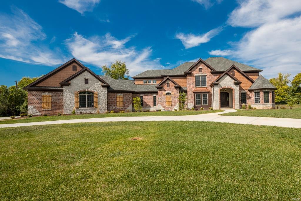 Newly constructed, custom built 1.5sty on 1+ acre! 4Bd/4.5Bth showplace, 6,800+/- sqft of living spc w/LL. Grand 2sty Foyer, Study/Den w/wood ceiling, formal Dining Rm & Great Rm w/gas frplc & dual French doors to porch. Gourmet Kitchen w/custom cabinets, suede granite counters, tile backsplash, center island, breakfast bar, pantry, top of the line SS appliances & Hearth Rm. Master Retreat w/huge walk-in closet & luxury Bth w/heated floors, steam shower, dual vanities w/granite & Laundry Rm complete Main Flr. 2nd Flr finds Loft area; Guest Ste w/Bth, 2 add’l Bds, Jack/Jill Bth & Bonus Rm. LL w/Rec Rm, Media Rm, full Bth, wine cellar & safe room. Highlights: 3 zone HVAC, LED lights, Andersen 400 series windows, solid wood doors, crown molding, 10 yr builder warranty, 3-car heated garage, circular drive, sprinklers & slateline shingle roof. Relax outside on covered patio & enjoy private yard! Great location ~ close to shops, restaurants, schools & hwys.