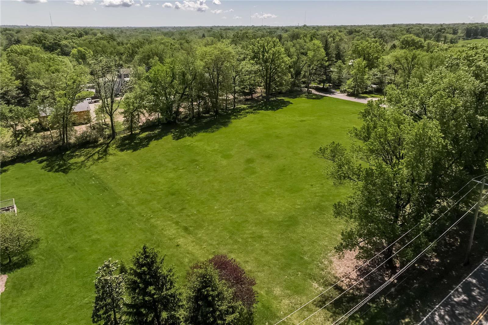Surrounded by multi million dollar properties, 9785 Litzsinger provides a great opportunity to BUILD YOUR DREAM HOME on this level 2.3+ acres lot.  So many possibilities.  This coveted property is located within the Ladue school district.  Drive your golf cart to Old Warson Country Club.  One of the lushest areas in Ladue!