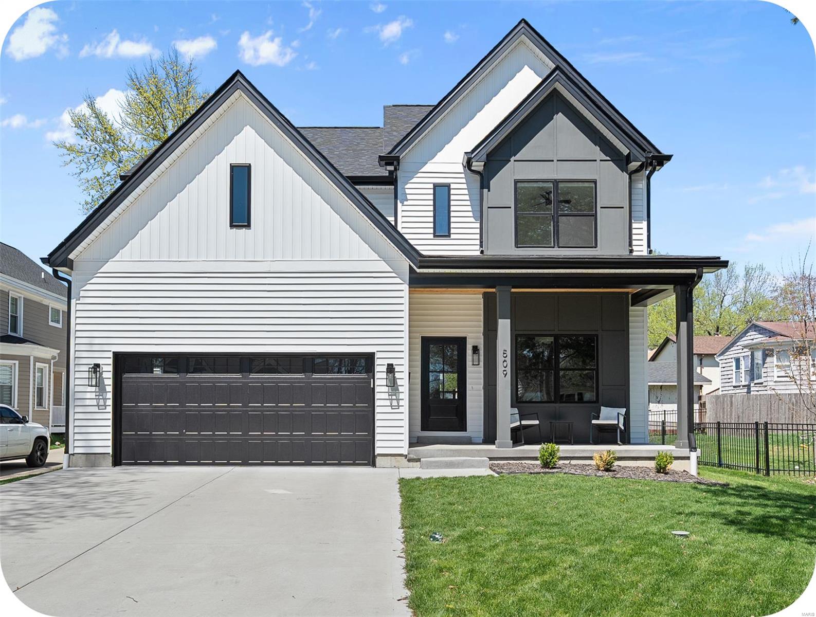 Welcome to this STUNNING 5 bedroom, 3.5 bath, 2 years young CUSTOM home where modern design meets everyday functionality. From the moment you arrive, the sleek exterior & covered front porch make a bold statement. Inside, enjoy a light filled, open concept layout with curated finishes throughout, from the striking black accent fireplace to designer lighting and warm wood details. The chef's kitchen features a large island, quartz countertops, & high end cabinetry, flowing seamlessly into the spacious living and dining areas, perfect for entertaining or cozy nights in. Upstairs offers 2nd floor laundry and 4 generously sized bedrooms, including a luxury primary suite with dual showerheads. A 5th bedroom & full bath in the finished lower level offer flexibility for guests, a 2nd office, or a playroom. Just 1 block from Kirkwood park on a beautifully developed street, this home checks every box: style, space, smart design, & LOCATION. Come see what custom craftsmanship really looks like!