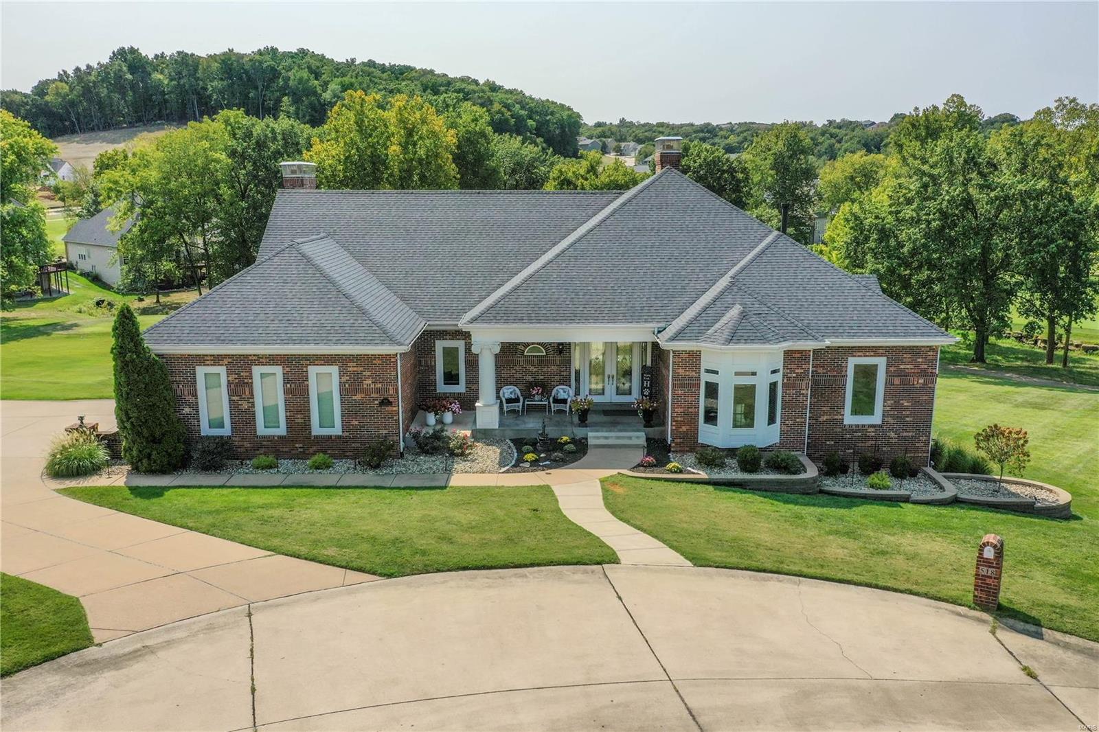 Beautiful Atrium Ranch overlooks golf course. Amazing Lot and Pool. Large entry w marble floors leads into vaulted Grt Rm
W/wall of windows, hardwood floors & gas fireplace.Kitchen w/custom cabinets, hardwood floors, granite counters skylight 
Mastered W/Coffered Ceil W/lots of windows. Light and Bright. Masterbath has Sep shower W/jacuzzi tub, Laundry Rm inside amazing walk in closet. 2nd Bedroom has full bath ensuite. Open staircase leads down to Walk Out Lower Level. Incredible entertaining space with full Bath & Bedroom, gas fireplace, Large Fam Rm, Huge Bar W/Refrigerator, dishwasher, wine cooler, granite counters, custom cabinets & Harwood floors. Custom designed Theatre Rm. Unfinished area has a hookup for additional laundry room if needed. Gunite Pool has built in Lounge deck, water feature & built in seats overlooking the 21st hole. Entire house is smart wired, 3 Car Garage. HVAC new in 2023, Roof new in 2024