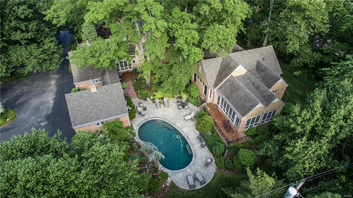 Built in traditional Williamsburg style w elegance, sophistication & amazing architectural detail which carries throughout the 2500+ square foot master suite addition providing a blend of charm & modern conveniences. Situated on a beautiful 1.8 acre lot w mature trees, lush lawn spaces, boxwood garden entry & 3 brick terraces one w wall fountain. Original landscape design by Edith Mason. Enjoy summer in the Pool Tron built lovely Pebble Sheen pool w waterfall & Bomanite decking. The home flows & entertains graciously & can live large or small. 9’ plus ceilings main floor. Lovely wood floors throughout much of the home & amazing moldings. Addition includes master bedroom w fireplace, his & her wonderful luxury baths, to die for closet, convenient laundry, office w built-in desks & abundant custom cabinetry & exercise room w space for equipment, massage table & complete w resistance pool & hot tub. Second floor w 6 bedrooms & 3 baths. Finished LL. 5 fireplaces. Generator. OS Garages