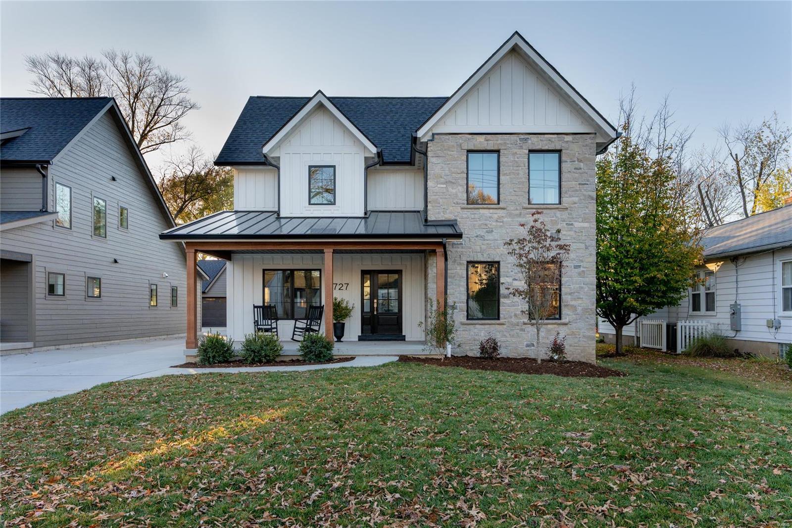This is not your average new construction home! A well-appointed front porch sets the expectation of what lies beyond the front door. Gleaming ¾" hardwood floors, Marvin windows, and 9' ceilings are found throughout. A gas fireplace with brick surround anchors the sunlit family room, offering an abundance of entertaining space. The dramatic eat-in kitchen features wood cabinetry, quartz counters, a huge island, and Fischer & Paykel appliances. The same aesthetic carries into the butler's pantry, which flows into the DR with board and batten walls. Main floor primary suite offers a stunning bath and a walk-in closet with laundry hook-up. Upstairs is an ensuite bedroom, two additional bedrooms that share a full bath, and a laundry room. Perfect parts finished space and storage; the LL offers a 5th bedroom, large rec room, and full bath. Out back is a lovely aggregate patio and detached garage with electric car chargers. Walkable to the Kirkwood Schools and Downtown Kirkwood!