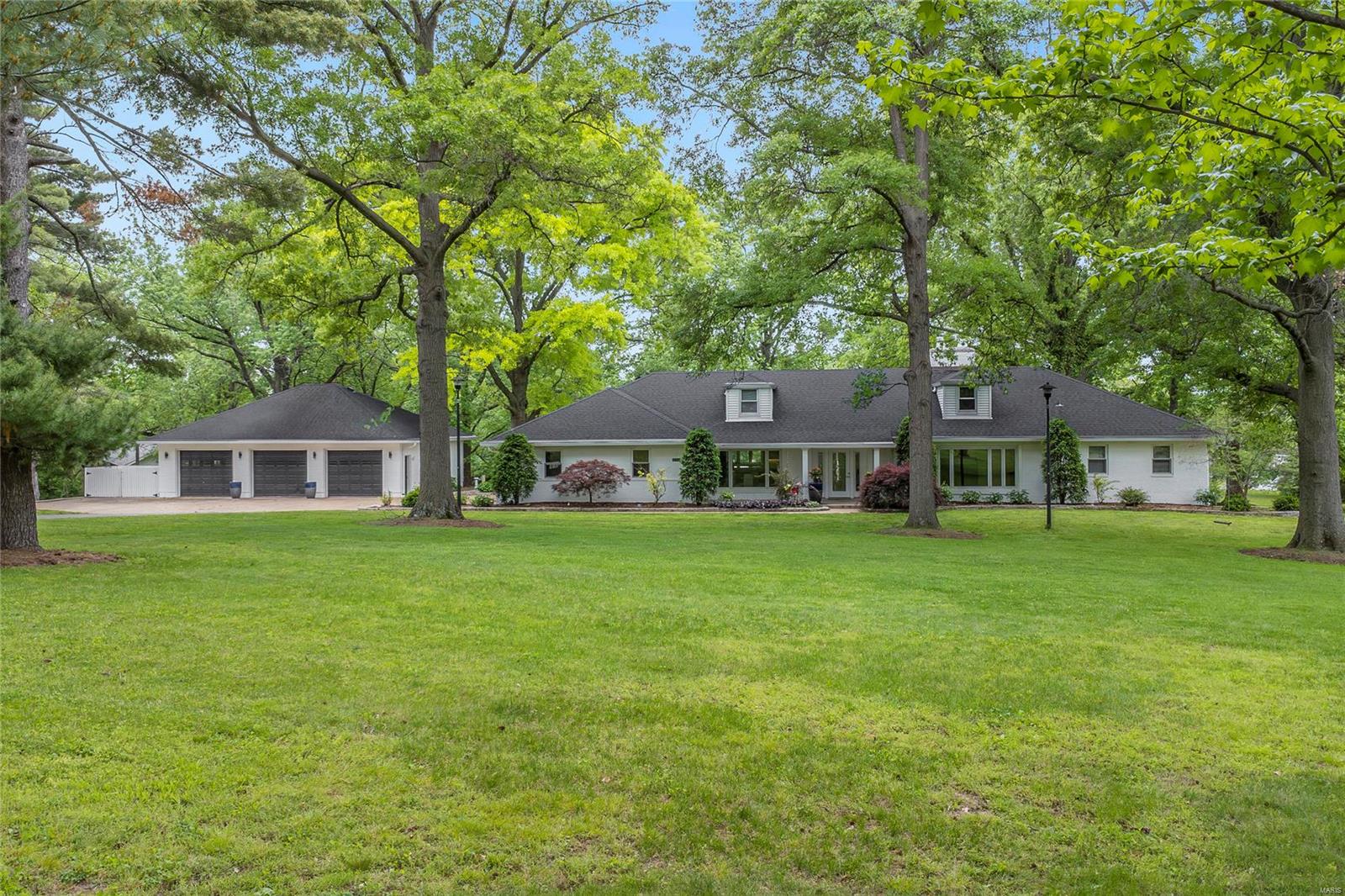 Spectacular, private West County retreat situated on an incredible park-like 2.56-acre lot! Updated inside & out, featuring 4 Bds/3.5 Bths & 6100+ sqft of living space. Gourmet eat-in Kitchen offers a tremendous amount of custom cabinets, marble countertops, handcrafted & polished SS backsplash, gorgeous breakfast bar & top of the line stainless appliances, including a 5-burner Jenn Air gas cooktop, custom hood, 2 ovens, wine fridge and Fisher & Pykel Dishwasher! Detached 3-car garage that is heated/cooled & could house another 3 to 6 cars, a boat or custom workshop! Walk-out LL is professionally finished with 540 bottle wine cellar! Relax outside in your own private oasis with views of the neighborhood pond, or take a dip in your beautiful inground salt-water pool with fountain (equipment updated 2016 to 2020) & large pool deck with multiple seating areas. This home is perfect for family gatherings & entertaining friends! Great location! Additional Rooms: Sun Room, Wine Cellar