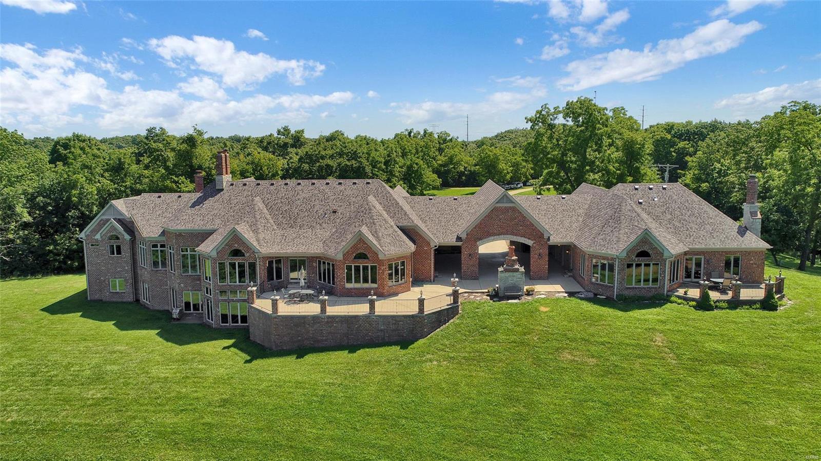 Tucked up high above the hills above St Albans Valley and eastern Franklin County lies this private retreat w 45 acres of unmatched quality. This view will stun you and you'll feel literally on top the world!There are 2 homes on this estate connected through a breezeway with sweeping large patio for this fresh air and views of the eagles flying high. This property is in unincorporated Franklin County and has no restrictions. Primary home is an atrium ranch w tons of windows and well thought out space. Many custom features here with built ins, natural stone counters, library, office plus huge Cathedral ceilings in great room. The secondary home is charming with this same quality, nice private patio and 3 car garage! There is a private lake w stone patio and gazebo, many hiking trails all over this 108 acres. In addition, there is a workshop extra 4 car garage with patio and fireplace for those cars, motorcycles, or hobbies. This is a truly unique estate in affordable Franklin County. Additional Rooms: Wine Cellar