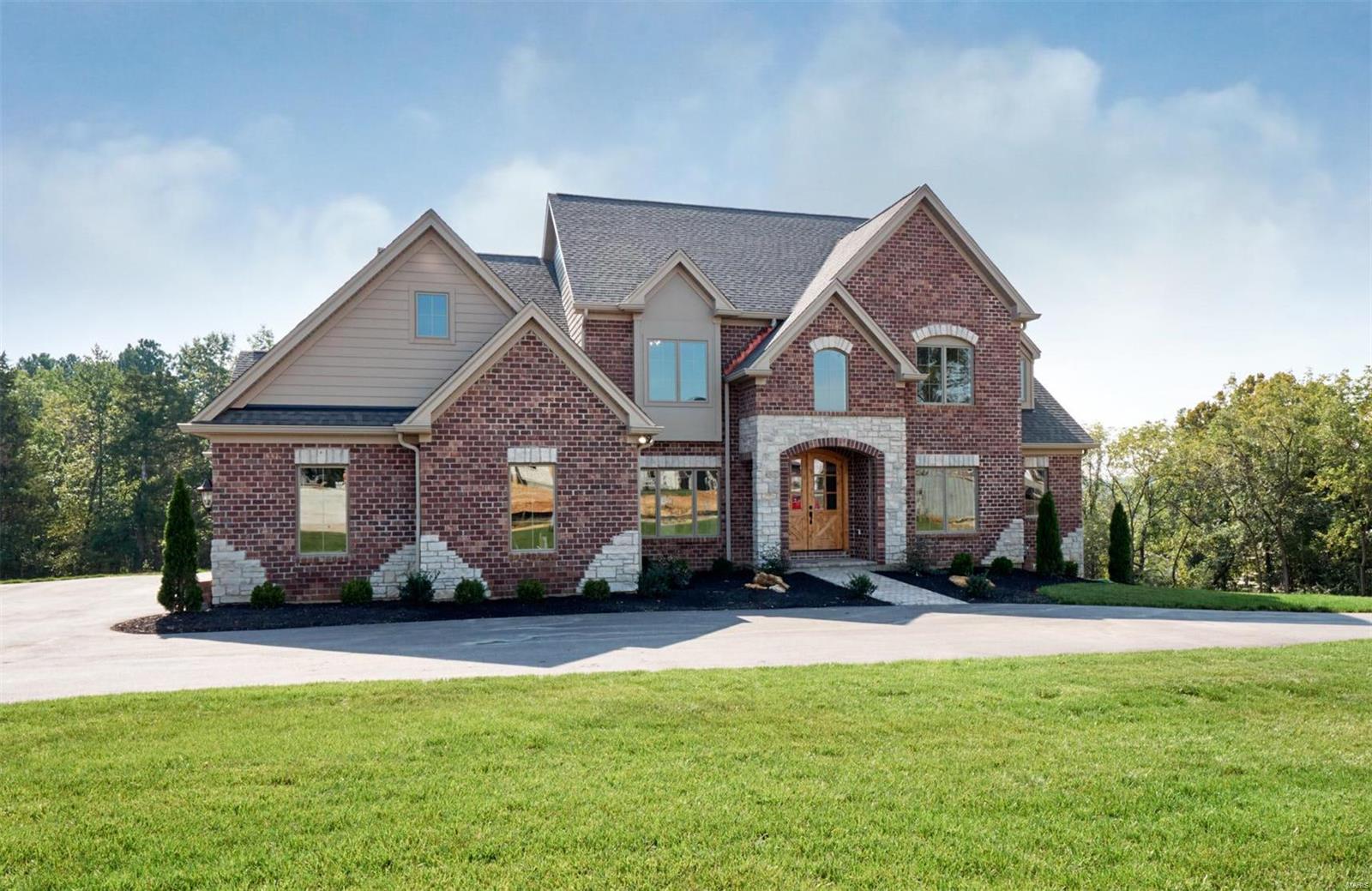 Welcome to your new home! With lots of light, plenty of space, and numerous luxurious amenities throughout, this home offers the potential for growth and comfort. Rehnquist Design & Build New Construction ready for move in. New home in an enclave of 6 new homes off Mason road in Town & Country. 5,000 sq. ft. 1 1/2 story on 1.688 acres. 10' Lower level pour with full rear walkout, room for a pool, over 1500 sq ft available to customize.  Main level boasts a master suite. 11' Ceilings in the Gathering room. Vaulted kitchen with breakfast room. Three (3) full suites each with a full bath and bonus room on second floor. Over sized three (3) car garage. Stonemont Subdivision homes range from $1,700,000 to $2,300,000. GPS Address use:2069 S Mason Rd. Open Saturday 10/12/19 12-2pm.