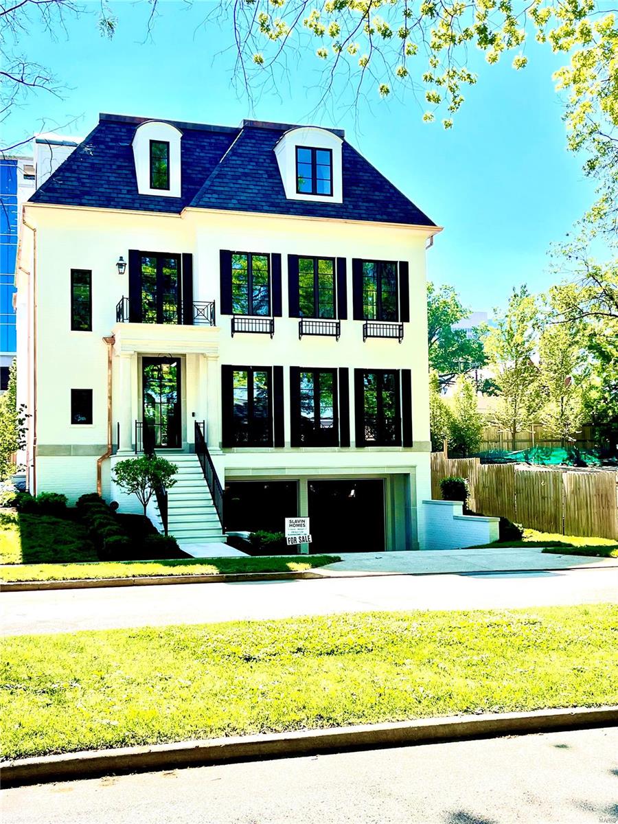 ONE OF A KIND 3 story home in the heart of Clayton.  Walk to all that Clayton has to offer.  Incredible views down the tree lined Westmoreland.  Built and designed by Slavin Homes, this is a rare opportunity to move into a finished Clayton home with no detail overlooked.  4 car garage, finished lower level with dual system walnut wine cellar, steel and glass thermally-broken front door, custom cabinetry, trim, and a master bedroom suite that must be seen.  10' ceilings on the main floors and second floor further enhance the home.  The 3rd floor with 9' ceilings offers 2 bathrooms, bar, large multipurpose room and a 4th bedroom. Additional Rooms: Wine Cellar