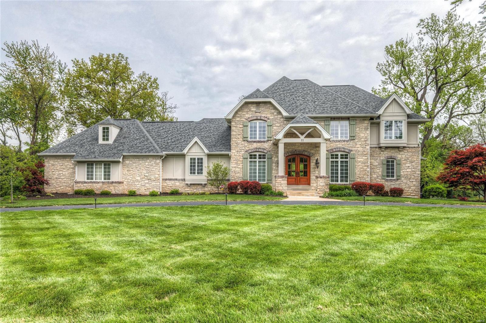 Exceptional custom built 1.5 story home sitting on a private level lot!  Custom front door entry is flanked by a study with wainscoting and beamed ceiling.  The dining room has a coffered  ceiling and special millwork.  Beautiful wood floors,  great room with 11’ ceilings and wall of windows overlooking the patio, built-in bookcases and a stone fireplace.  Open kitchen, breakfast and hearth room.  High end stainless appliances, large center island, stained custom beams and a second fireplace with raw timber beam mantel.  The laundry room has a built-in desk, cubbies and a large coat closet.  The master suite is on the main level and has a luxury bath with walk-in shower and a walk-in closet.  The upper level has three additional bedrooms, two full baths and a bonus room for the kids to hang out.  Fabulous home!  Convenient location and  Parkway Schools! Additional Rooms: Mud Room