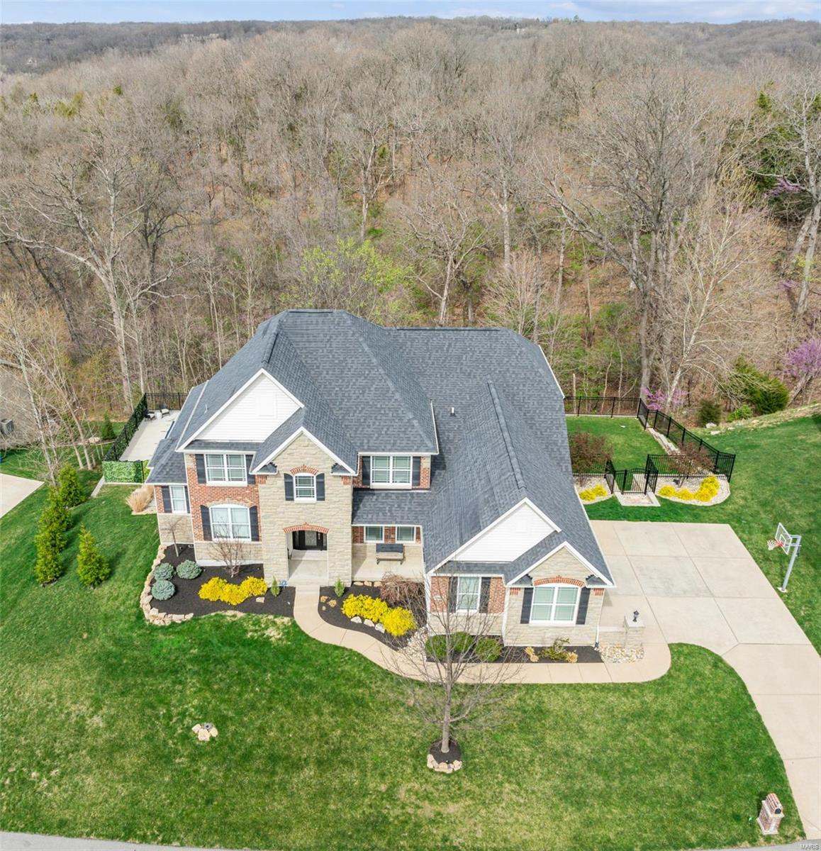 Custom Lombardo MOVE-IN ready home in sought after Homestead Estates- 5 Beds, 5 Baths over 4700sgft on 1.19 acres.  Designed for the discerning buyer this stunning residence offers perfect blend of spacious living & peaceful privacy.  Open layout is perfect for entertaining-formal dining, spacious Great Room w/gas stone FP, wall of windows, cathedral ceilings.  Custom open kitchen w/gas cooktop, double ovens,large center island, walk-in pantry, planning area.  Primary Suite w/luxury bath & custom walk-in closet on main.  UL boosts Loft & 3 spacious beds w/large walk-in closets, one en suite & 2 w/JacknJill bath.  Professionally finished w/o LL has 5th bed/office, full bath, bonus/theater rm w/projector & game area.  INCREDIBLE Backyard Oasis has 16x40 Saltwater Aloha Pool w/tanning deck, large level side yard for the kids, covered patio & screened in deck.  Highlights-3 car side entry garage, custom millwork, wood floor, main floor laundry, fiber optic internet.  Highly Rated Schools.