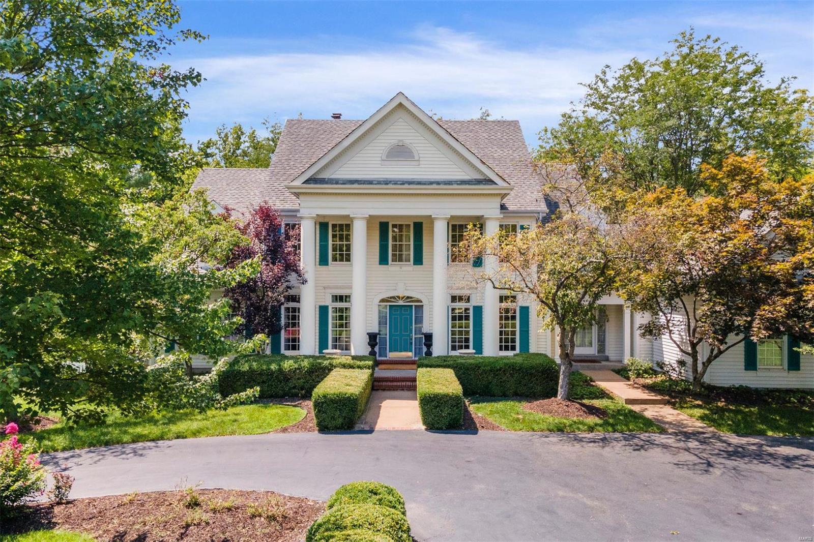 A complete refresh at this lovely colonial home with just under 5,000 sqft of above grade living space. Freshly painted and new carpet throughout. Two-story living room with floor to ceiling windows overlooking gorgeous rear yard, plus dining room, wood-paneled study, primary suite with newly tiled bathroom, kitchen open to hearth room and laundry room complete the main. 3 bedroom suites on upper and a 1,500 sqft finished lower level with a 5th bedroom, full bath, family room with fireplace & bar and a dance/fitness room. 3 car garage and level fenced acreage. Walk to Rossman School & Covenant Seminary. Easy access to area hospitals and 40/64 thoroughfare.