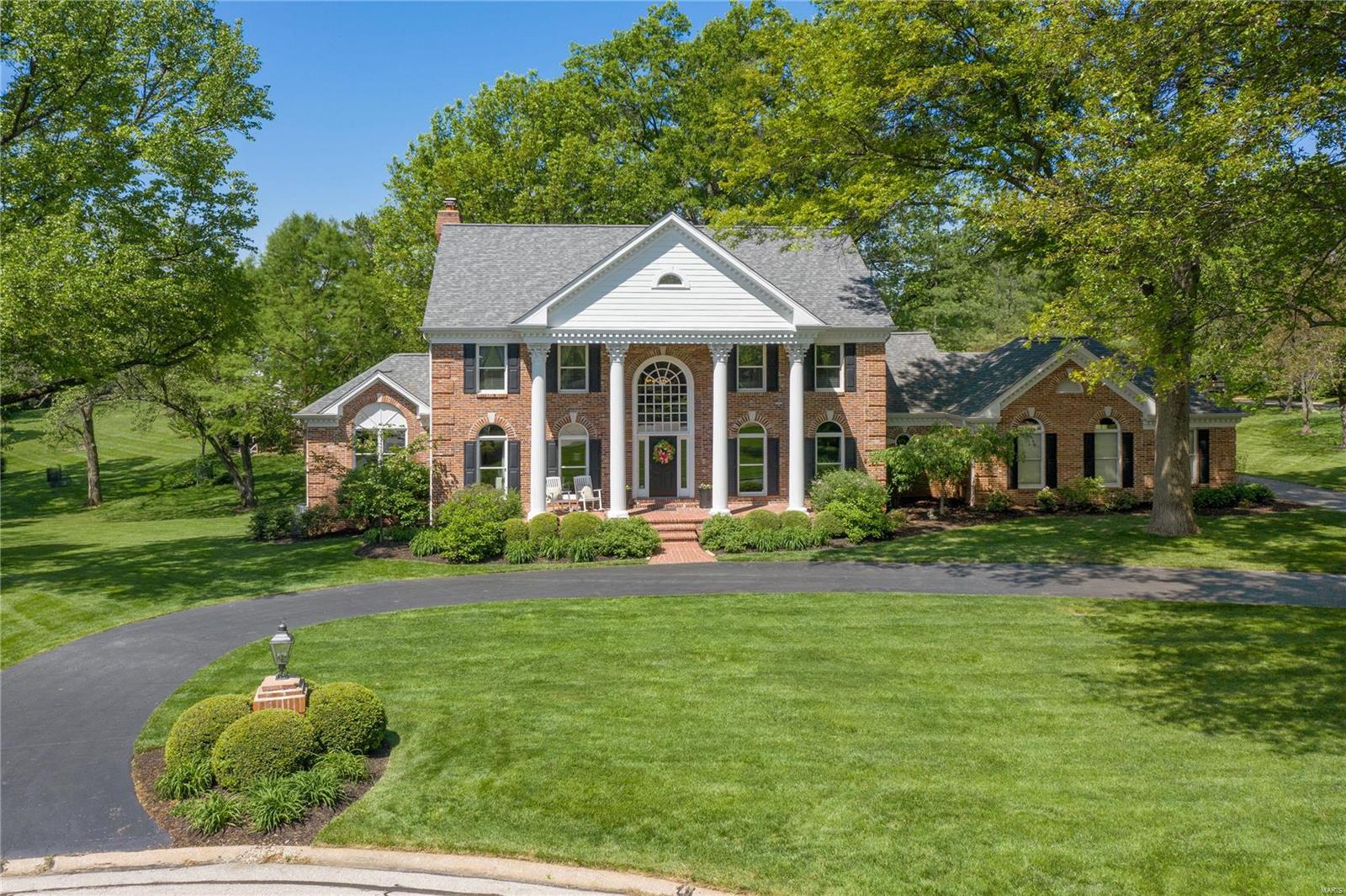 Welcome to Town & Country living at its finest! Situated on a 1 acre level lot on a private lane, this light filled home is gracious & inviting with space for everyone. The formal dining room & living room are generous in size.The family room w/box beam ceiling has a two sided fireplace that serves this room and the office/den on the other side. The expansive kitchen includes a 4 burner gas cooktop with downdraft exhaust, double ovens and a large pantry and is open to the sunroom with vaulted ceiling, two skylights and access to the deck. The primary suite is grand with an updated bathroom & organized closet. There are 3 additional bedrooms and 2 updated baths that complete the upstairs. The walk-out lower level is a world of its own with a possible 5th bedroom, updated full bath and multiple entertaining zones. Once outside you are greeted by a covered patio with bar & beyond you have a built-in grilling area with pergola and a large seating area with fireplace. Truly a special home! Additional Rooms: Sun Room