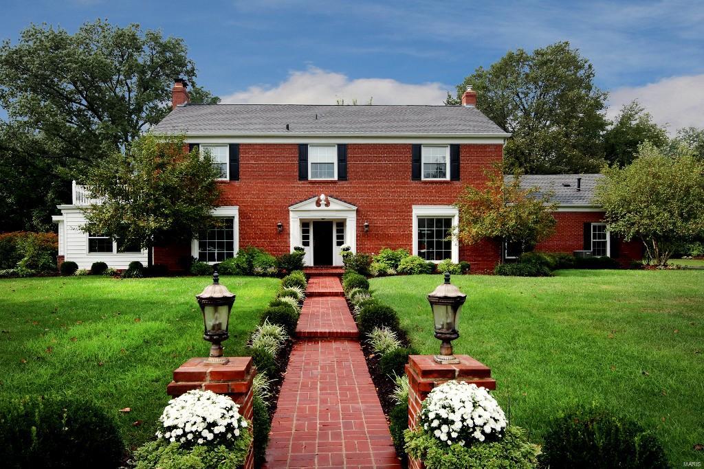 *Back on Market!* Beautiful Briarcliff home boasting neutral decor, situated on a corner lot in this desirable Ladue neighborhood! The flowing floor plan features formal & casual spaces - perfect for entertaining as well as day to day living. The center hall plan offers an entry foyer with dining room on one side & living room w/fireplace on the other, den/office w/built-ins off of the living room, stunning updated kitchen with granite countertops located next to the spacious family room, and a half bath complete the main level. The second level includes a master bedroom suite, 3 additional bedrooms and 2 additional full baths. Also in the second floor, accessed by a separate staircase, is the 5th bedroom suite currently used as an office, but would be perfect for a nanny, teenager, or in-laws. The lower level includes a paneled recreation room with a fireplace. Relax by the pool and enjoy the expansive patio and lush landscaping this summer!