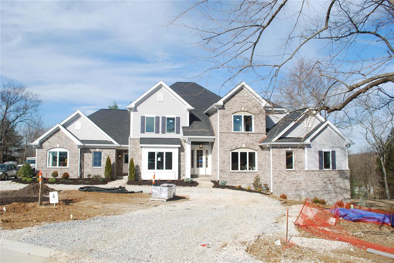 The new custom home at Lot 4, 13761 Stonemont Ct will feature an open floor plan which allows rooms to flow together. The home will be approximately 4,400 sq.ft. Lot 4 Stonemont will be a 1.5 story home in an enclave of 6 new homes on a total of 8.5 acres. The home site is a walk out site with a private back drop and future pool area. The new home features a luxurious master suite on the first floor and three full bedroom suites on the second floor. To enhance the open floor plan the home will have a bright daylighted interior with substantial sized windows throughout. An oversized side entry three car garage allows for additional space. The home site is located in Town & Country off Mason Road just south of Queeny Park. This custom home is a tremendous value that is priced well below new custom homes in Town & Country.