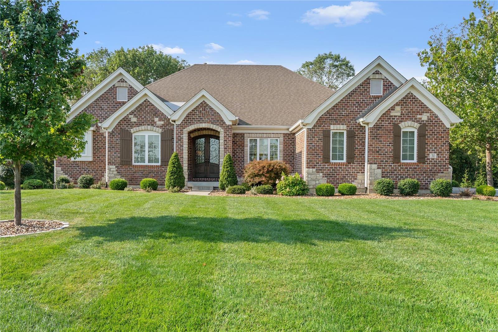 Back on the Market! NO fault of the seller, buyer’s financing fell through! Just a short walk away from all club amenities, this beautiful ranch home greets you w/ gleaming hardwood floors & custom millwork throughout. Entertaining is a delight w/ an open floor plan, seamlessly flowing from the formal dining into the great room, featuring one of 3 fireplaces & a private office w/ French doors. The gourmet kitchen boasts granite countertops, custom cabinetry & convenient wet bar. Adjacent is the breakfast & hearth room w/ beamed vaulted ceilings. Side service & garage entry open to the spacious drop zone & separate laundry, adding to the home's functionality. The spacious primary suite features an expansive en-suite w/ a walk-in shower, double sinks & organized closet. The walk out LL boasts a rec room w/ an expansive bar, add'l bed, full bath & plenty of storage space. Outdoor living is elevated w/ a stunning deck, stone fp & covered patio, all overlooking the private .76 acre lot! Additional Rooms: Mud Room