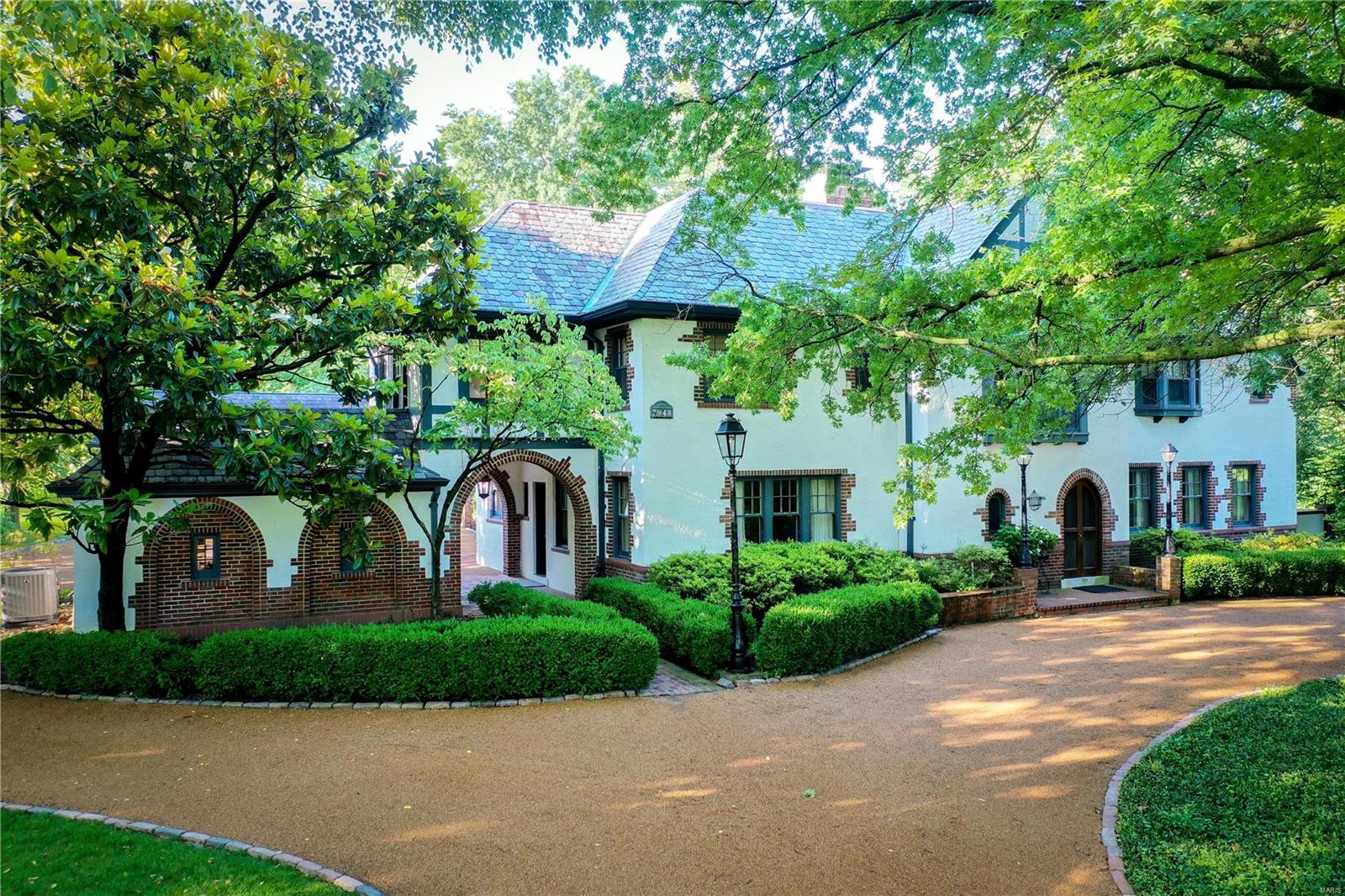 Historic, traditional French Cottage in sought after Hampton Park features a private, park-like setting & stunning outdoor space,  4 beds/2.5 baths. The spacious living room and dining room are perfect for entertaining. An updated kitchen with an abundance of  cabinets, granite counters, wet bar flows to a charming family room with beamed ceiling and a wall of windows providing a picturesque view of the lush gardens & pool. A gracious foyer boasts woodburning fireplace & a sweeping staircase w/ exquisite, custom mill-work, original hardwood flooring & pocket doors.  The in-ground pool is surrounded by blue slate patio and gardens.  The outdoor pavilion is spectacular w/ half bath & greenhouse, complements the outdoor landscape. A home office offers add'l flexibility for a fitness or playroom. The heated 5-car garage could be easily transformed to man cave, in-law suite.   Just use your imagination. And, for your piece of mind, a whole house generator.  This home is one-of-a-kind. Additional Rooms: Sun Room