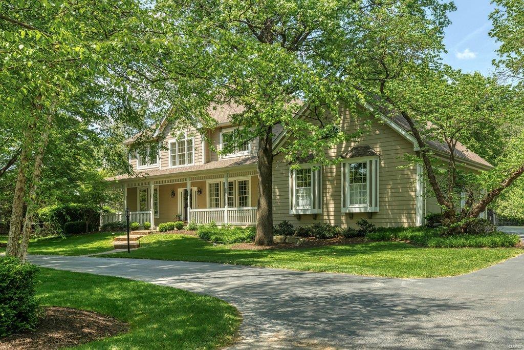 Exceptional 2-sty Colonial with remarkable curb appeal. Center hall floor plan features light-filled rooms with oak hardwoods, extensive millwork & bay windows. Wide covered porch entrance leads to impressive 2-sty foyer, formal living & dining rooms with detailed trim work & spacious family room with floor-to-ceiling brick fireplace flanked by built-in bookcases. Chef’s kitchen with granite countertops, 42” white cabinetry, premium stainless steel appliances & 6’ center island adjoins breakfast room with double atrium doors that open to private deck. Coffered master bedroom suite with walk-in plus double closet & beautifully appointed bath with jetted tub offers an appealing retreat. 3 Generous-sized additional bedrooms & hall full bath complete the 2nd floor living quarters. Open staircase accesses Lower Level entertainment space with recreation room, game room & half bath. Situated on a 1-acre cul-de-sac lot with deck, patio & pool surrounded by landscaped gardens.