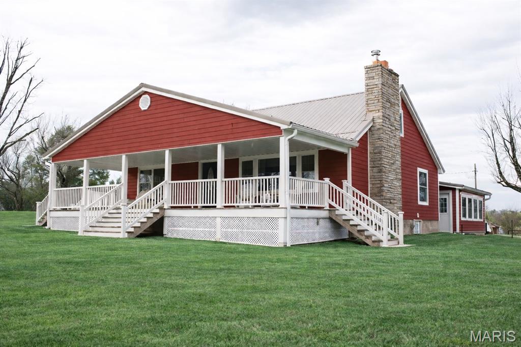 *3% from seller toward buyer's closing cost and prepaid expenses. Owning this stunning 14-acre private farmstead with equestrian potential, where timeless country charm meets modern comfort and functionality is more attainable than than you thought. 

For those seeking a true farm lifestyle, this property is fully equipped and ready to go. From the moment you arrive, you’ll be captivated by the rolling acreage, scenic views, and beautifully coordinated farmstead that create a picture-perfect setting in every direction. Properties like this are incredibly rare — a turnkey farm with acreage, multiple buildings, guest living space, and breathtaking views.

At the heart of the property sits a beautiful 2630 sq ft modern 4-bedroom, 2-bath farmhouse, thoughtfully updated inside and out. Designed for both comfort and entertaining, the home offers inviting living spaces and a warm, welcoming feel throughout. Start your mornings with coffee on the expansive covered front porch, and end your evenings relaxing on the large patio overlooking the peaceful countryside, while kids and pets enjoy the wide-open yard.

One of the property’s valuable features is the separate 1,100-square-foot guest house, offering exceptional flexibility. Complete with a full bathroom, kitchenette, laundry hookups, storage area, and ADA-accessible design, it is perfect for extended family, a private home office, studio, daycare, guest quarters, or even income-producing opportunities.

The land includes a classic red barn with stalls, milk house, and chicken coop, along with multiple additional outbuildings ideal for equipment, livestock, workshops, or hobby spaces. An extra-large garage provides abundant room for vehicles, tractors, and storage, with electricity already in place in most out-buildings.  The 14 acres are fenced and cross-fenced, creating ideal pasture for horses, cattle, or hobby farming, making this an exceptional opportunity for equestrian enthusiasts or anyone seeking a functional working farm.

Adding to the property’s charm and curb appeal, the home, barn, and outbuildings are beautifully coordinated in color, creating a cohesive and picturesque farmstead that feels straight out of a countryside magazine.

This one-of-a-kind property truly must be experienced in person. Its beauty, character, and peaceful setting are something photos simply cannot capture. Duplicate property on MLS#26012466