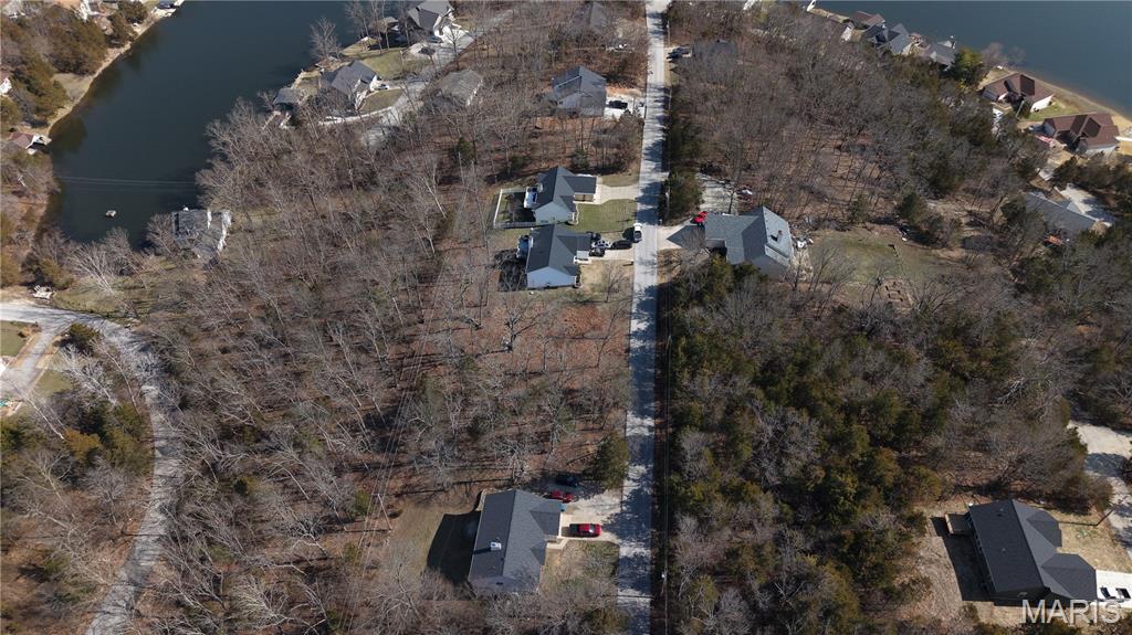 Builders Package: Next To New Construction! Right down from the BIG LAKE! Buy as an individual lot for lake access or check out the neighboring lots to purchase as a package and save, save, save! These ready-to-build home sites are located in this private, gated, resort-style community with 3 lakes, golf course, campgrounds and more. Perfect for builders to market to anyone seeking a peaceful, recreational lifestyle away from St. Louis, but still very close for easy family visits. Also perfect for get-away lake home. Enjoy the golf course, lake, boating, fishing, clubhouse, pool, etc. ! Just 20 minutes from South County! Builders Package:

Can be combined with:
5615 Katys Way (Cleared Lot) 
5621 Katys Way (Double Lot)
5623 Katys Way (Double Lot)
5629 Katys Way (Double Lot)
5631 Katys Way (Double Lot)

& More!