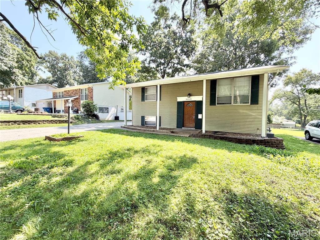 Welcome home to this well-designed 4-bedroom, 2-bath split foyer offering flexible living space on both levels. The bright main level features an open floor plan with a spacious living room highlighted by a large picture window, along with an eat-in kitchen and dining area that opens directly to the deck—perfect for everyday living and entertaining. The kitchen offers an efficient layout with abundant cabinetry and plenty of storage. Two bedrooms and a beautifully updated full bath complete the main level. Downstairs, the finished lower level adds even more room to spread out with two additional bedrooms, a second full bath, and a spacious family room ideal for movie nights, guests, a home office, or recreation space. A separate laundry and storage area provides added functionality, while walk-out access leads directly to the backyard. Outside, enjoy a fenced yard with both a deck and large patio, creating multiple spaces to relax, entertain, or enjoy the outdoors. Off-street parking adds everyday convenience. With four bedrooms, two full baths, and versatile living areas throughout, this home offers plenty of space and flexibility to fit a variety of needs.