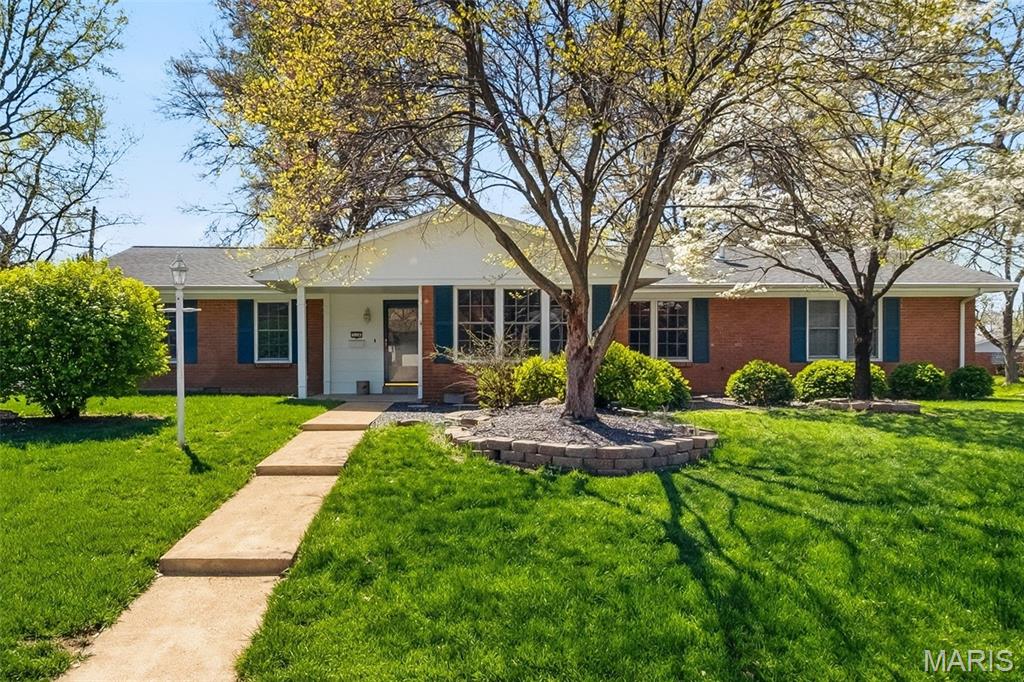 Located in the highly sought-after Dorchester Village Subdivision, this impeccably maintained all-brick ranch is a perfect fit for a first-time buyer or someone looking to downsize without sacrificing space or style. Offering 1,530 square feet of thoughtfully designed living space, this home blends timeless charm with modern comfort—all nestled on a spacious .26-acre corner lot along picturesque, tree-lined streets. Step inside and you’re immediately greeted by gleaming original hardwood floors, sun-drenched rooms, and an abundance of newer windows that fill the home with natural light. The semi-open floor plan features wide openings, elegant concave crown molding, and a seamless flow between the oversized living room, formal dining area, and inviting family room—creating the perfect central hub for everyday living and entertaining.
The family room connects effortlessly to the kitchen and opens to the backyard through French doors with built-in blinds. The large eat-in kitchen is both functional and stylish, featuring updated luxury vinyl plank flooring and ample space for gatherings. The primary suite offers a private retreat with an ensuite bath and dual closets, while the additional bedrooms provide comfort and flexibility. You’ll appreciate the character-rich wood trim paired with touches of modern lighting throughout. One-level living extends into the deep two-car garage, complete with generous storage, a workshop area, washer/dryer setup, and even attic storage above. Enjoy peace of mind with major updates already completed, including a newer roof with architectural shingles and ridge cap, updated electrical panel, and newer water heater. This home is truly move-in ready, yet offers exciting potential for your own custom upgrades over time. Outside, the curb appeal shines with beautifully maintained landscaping, stone-edged garden beds, and mature trees providing the perfect balance of shade and sunlight. The fully fenced backyard features white vinyl privacy fencing, a large storage shed, and an oversized deck—ideal for entertaining, relaxing, or enjoying everything from summer BBQs to cozy winter fire pits. Perfectly located near major highways, parks, trails, shopping, dining, and healthcare, this home delivers both convenience and lifestyle. Merely blocks from St. Clair Country Golf Club & the Dorchester Swim & Tennis Club, minutes from Eckert's Family Farm, Scott AFB, Downtown Belleville, and just a short drive to the St. Louis metro area and everything it has to offer—this is location, value, and livability all wrapped into one that is the perfect blend of comfort & style—don’t miss your chance to call it home!