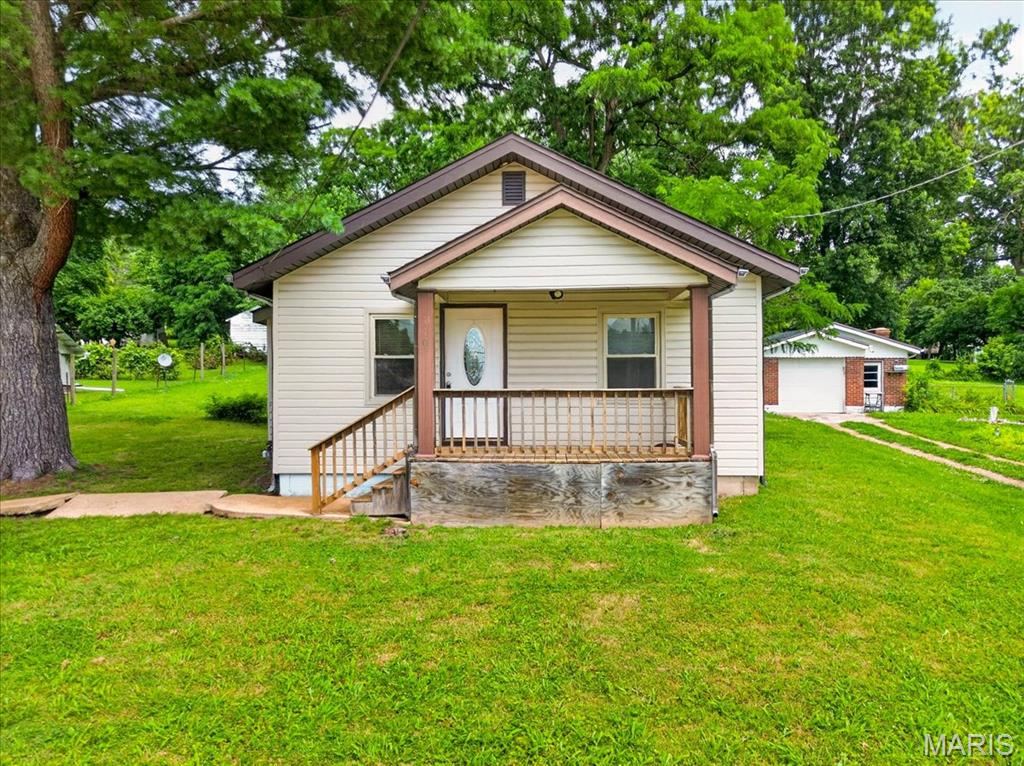 Opportunity awaits at 110 Edgeworth Ave! Whether you're searching for an affordable place to call home, your next investment property, or the perfect site to build your dream home, this property offers endless possibilities. Located in the A-rated Pattonville School District (niche.com). You'll love being just minutes from the Maryland Heights Community Center, Westport Plaza and Aquaport, making summer days a breeze. An inviting front porch welcomes you to this two bedroom, one bath home that sits on a generous 0.3 acre lot with convenient 2 car parking pad. Entering the home, hardwood floors flow from the living room into the kitchen featuring stainless steel appliances and ample counterspace. Adjoining the kitchen is the main level laundry and utility room. Two bedrooms, both with LVP, and full hall bath round out the house. With quick access to I-270 and Page Avenue, you're surrounded by endless shopping, dining, and entertainment while also enjoying an easy commute to St. Charles or Downtown St. Louis. Whether you choose to move in, rent it out, renovate, or build new, this prime location offers exceptional convenience and limitless possibilities.  This one will not last!  Schedule your showing today!!
