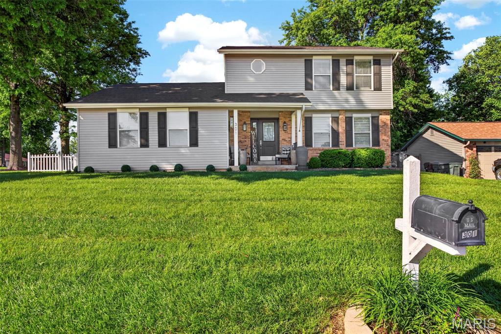 Welcome to 301 Rachels Trail—where modern updates, timeless comfort, and exceptional entertaining spaces come together in one beautifully maintained home. From the moment you arrive, the impressive curb appeal, mature trees, inviting covered front porch, and updated exterior create a warm and elegant first impression.
Step inside to a light-filled interior featuring stylish finishes, designer paint, updated light fixtures, and luxury vinyl plank flooring that flows beautifully throughout the home. The spacious living room offers a warm and welcoming atmosphere, while the formal dining room with tray ceiling provides the perfect setting for gatherings and special occasions.
The heart of the home is the stunning open-concept kitchen and vaulted hearth room. Showcasing crisp white cabinetry, granite countertops, stainless steel appliances, subway tile backsplash, and abundant prep space, this kitchen seamlessly opens to the breathtaking family room complete with soaring ceilings, dramatic beams, custom built-ins, and a beautiful gas fireplace that anchors the space with warmth and character. Large patio doors invite natural light and create a seamless connection to the outdoor living areas.
Thoughtfully updated throughout, this home features a long list of improvements including a new roof , fence, vinyl siding and shutters in 2023, remodeled half bath and second-floor bath, luxury vinyl plank flooring, garage door and opener, updated appliances, designer lighting, patio door, granite countertops, and extensive cosmetic enhancements that make this home truly move-in ready.
Upstairs, the spacious primary suite offers a peaceful retreat with generous closet space and a beautifully updated bath featuring dual vanities and modern finishes. Additional bedrooms are generously sized and thoughtfully designed with stylish details throughout. 2nd Floor laundry for added convenience.
The finished lower level provides incredible flexibility with additional living space perfect for a recreation room, guest suite, office, or workout area.
Outdoor living truly shines with the expansive fenced backyard featuring a custom outdoor kitchen, beautiful paver entertaining area, relaxing hot tub retreat, and storage shed—creating the ideal setting for summer gatherings, relaxing evenings, and effortless entertaining.
Beautifully updated and impeccably maintained, 301 Rachels Trail offers the perfect blend of luxury, comfort, and functionality in a desirable setting you will love calling home.