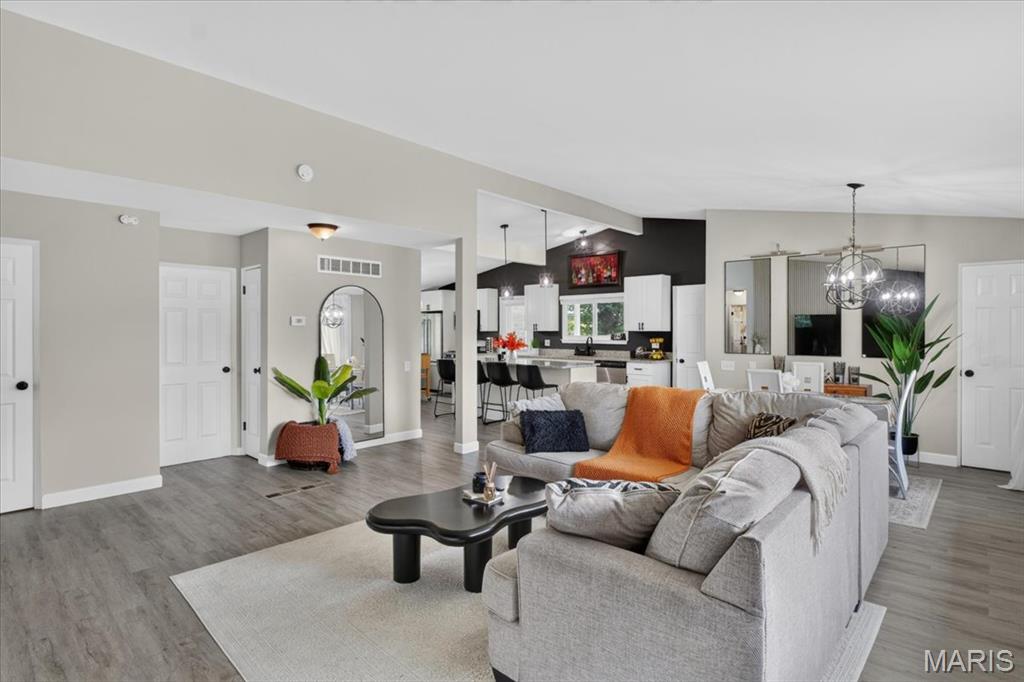 Welcome home to this beautifully updated ranch tucked away on a quiet cul-de-sac! Offering 4 bedrooms, 2 full baths, and an attached 2-car garage, this move-in ready home combines modern updates with comfortable everyday living. Step inside to an open, light-filled floor plan where large windows, fresh finishes, and stylish flooring create a bright, welcoming atmosphere. The beautifully updated kitchen is the heart of the home, featuring granite countertops, stainless steel appliances, abundant cabinetry, a center island with seating, pantry, and an inviting breakfast area that's perfect for casual meals or entertaining. The spacious primary suite offers a private ensuite bath, while three additional main-level bedrooms provide flexibility for family, guests, or a home office. The finished lower level expands your living space with brand-new carpet and endless possibilities for a recreation room, media space, fitness area, hobby room, or additional sleeping quarters. Outside, enjoy the oversized, park-like backyard with plenty of room to entertain, garden, play, or simply relax, plus a covered patio, storage shed, and low-maintenance brick and vinyl exterior. Recent improvements include updated windows, front door, smart locks, interior paint, flooring, carpet, light fixtures, and interior doors, giving buyers peace of mind and modern style throughout. Even better, the transferable Choice Home Warranty Ultimate Plan with approximately three years remaining offers added value. Conveniently located near shopping, dining, parks, and major highways, this exceptional home is the complete package. Schedule your private showing today before it's gone!
